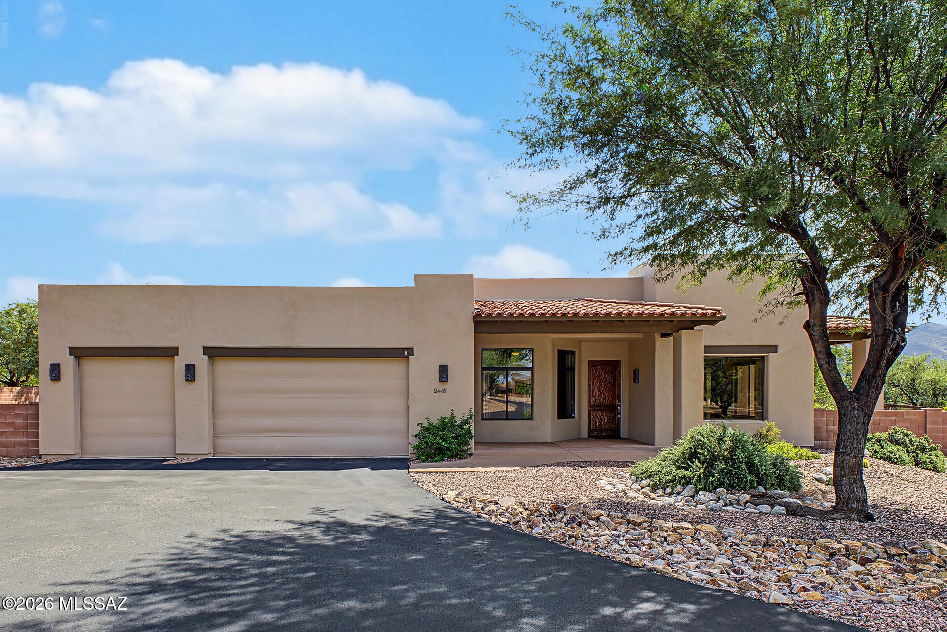 This beautiful 4-bedroom, 3-full-bathroom home is tucked away in a gated community on a private .83-acre lot, offering an incredible amount of space and a blank canvas for all your outdoor dreams. The lot features beautiful, large mature mesquite trees, adding shade, character, and privacy to the property. Enjoy mountain views and peaceful morning sunrises from this special home.
The home features a huge 3-car garage, newer exterior paint, a recently coated roof, and owned solar that helps create a minimal-to-no electric bill. Inside, you'll find high ceilings, tasteful modern paint colors, roll-down interior solar screens, ceramic tile throughout the main living areas, and carpet in the bedrooms that gives the home a warm, comfortable feel. The kitchen is equipped with granite countertops, a gas cooktop, built-in microwave and oven, and opens to the great room, breakfast bar, and dining area, making it a wonderful space for everyday living and entertaining. The home also features a gas fireplace, ceiling fans throughout, plenty of storage, and a spacious laundry area with cabinets and a sink. Two of the secondary bedrooms are connected by a convenient Jack-and-Jill bathroom, and both bedrooms feature large walk-in closets. The primary suite is truly spacious, with direct access to the outdoors and an additional nook that could be used as a home office, sitting area, or simply as extra space to make your own. The oversized walk-in closet provides plenty of storage.
The primary bathroom offers separate vanities, a soaking tub, an extra-large walk-in shower, and a private toilet room.
Step outside to enjoy the covered back patio or the charming smaller covered side patio. With the privacy of a gated community, expansive .83-acre lot, mature mesquite trees, mountain views, owned solar, and generous living spaces, this home offers plenty of room to make it your own and enjoy the Arizona lifestyle.