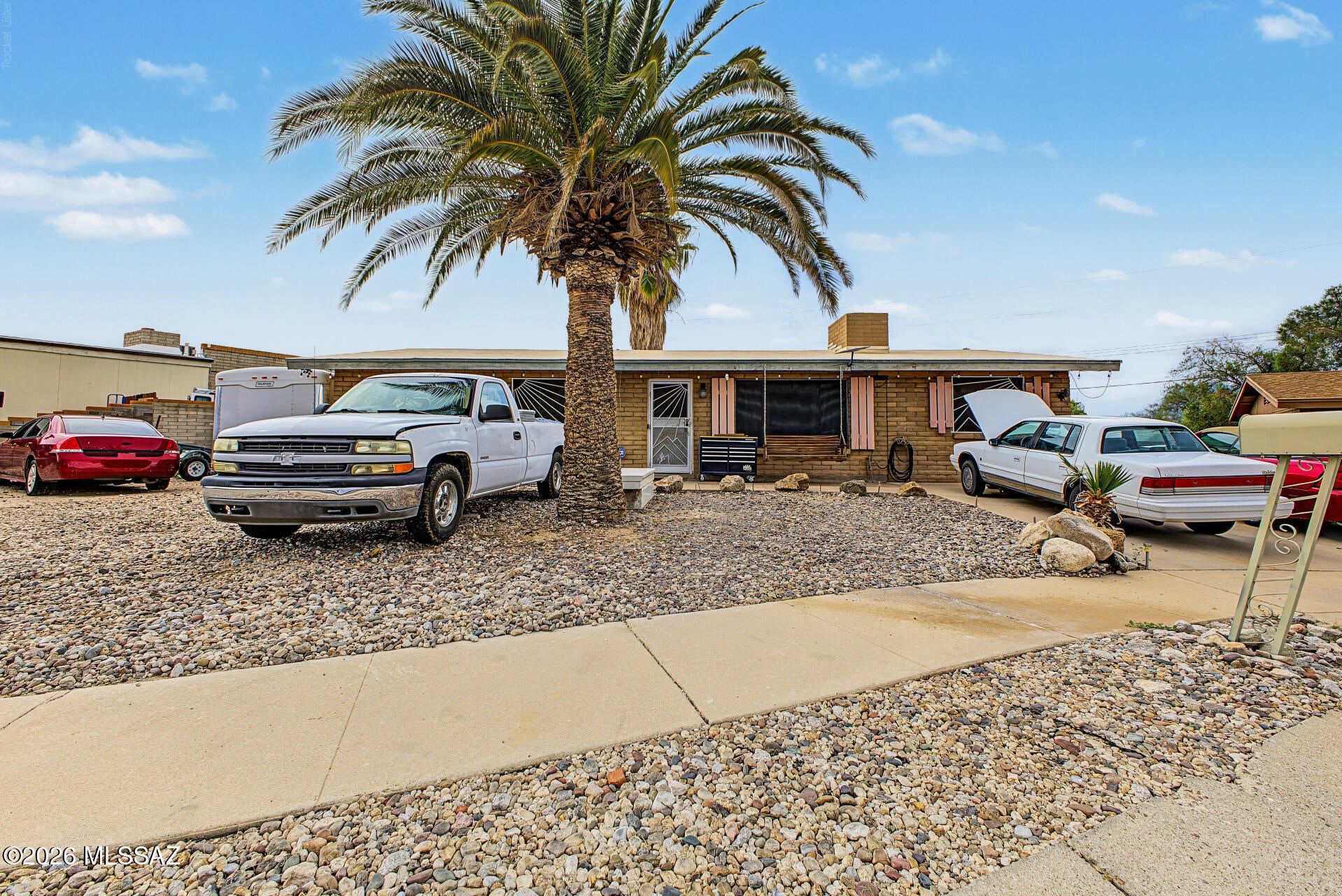 Unlock an incredible equity-building opportunity with this 3-bedroom, 2-bath pre-foreclosure property, priced for the savvy buyer! This cul-de-sac residence welcomes you w/ a serene living room featuring tile flooring & a fireplace for cozy evenings. The eat-in kitchen comes w/ wood cabinetry w/ crown moulding, a mosaic tile backsplash, SS appliances, & a peninsula w/ a breakfast bar. The main bedroom includes a built-in closet & a private bathroom. You'll also find a bonus room that offers a versatile living space & makes true SqFt ~1370. Spend enchanting moments in the charming backyard, showcasing a covered patio, a relaxing spa, pavers, pristine artificial turf, an in-ground trampoline, an RV gate that leads to the alley, a storage shed, & breathtaking mountain views. Make this yours!