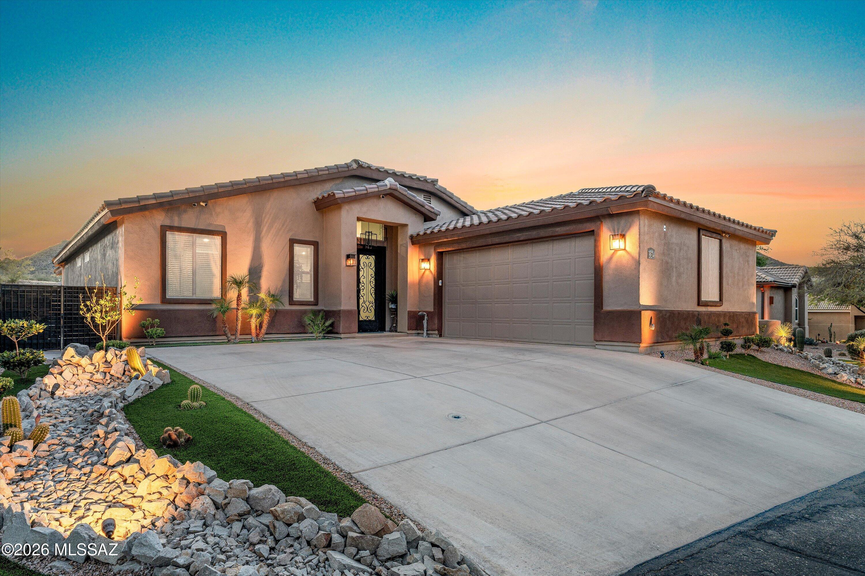 Welcome to Starr Pass! This 2019 semi-custom home is a must-see, in a location that truly is one of a kind. Resort style living at its finest at the base of the Starr Pass Marriott - a 5 minute walk to the clubhouse, with golf carts, neighbors walking, and wild deer roaming the neighborhood. Watch the annual 4th of July fireworks from your fully landscaped backyard or from your bedroom. Upgraded construction used to build this home, an American Standard Platinum HVAC unit included, stone and wood touches throughout, stainless steel appliances, granite countertops, and an enormous walk-in shower in the owner's suite - this property has comfort and luxury built into every inch. Wood look tile in the main area of this home, expansive ceilings, and plenty of open space allow for a bright, airy environment. A true gem that must be seen!