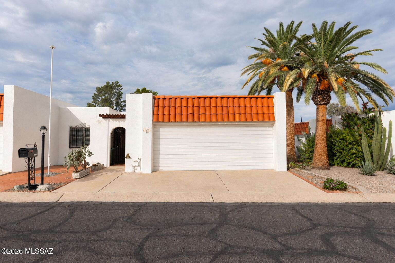 Enjoy the Tucson golf lifestyle in this charming, single-story 2-bedroom, 2-bath townhome in Dorado Country Club Estates, ideally situated along the golf course! Ready for your personal touch, this spacious home features a large great room with a cozy fireplace and a versatile flex room perfect for a den, home office, or library. Relax in the covered, enclosed patio/Arizona room while enjoying beautiful golf course views with your morning coffee or evening drink. A spacious two-car garage adds convenience. The HOA covers road and front yard maintenance, plus access to the community pool and spa. Conveniently located near shopping, dining, hospitals, and entertainment!