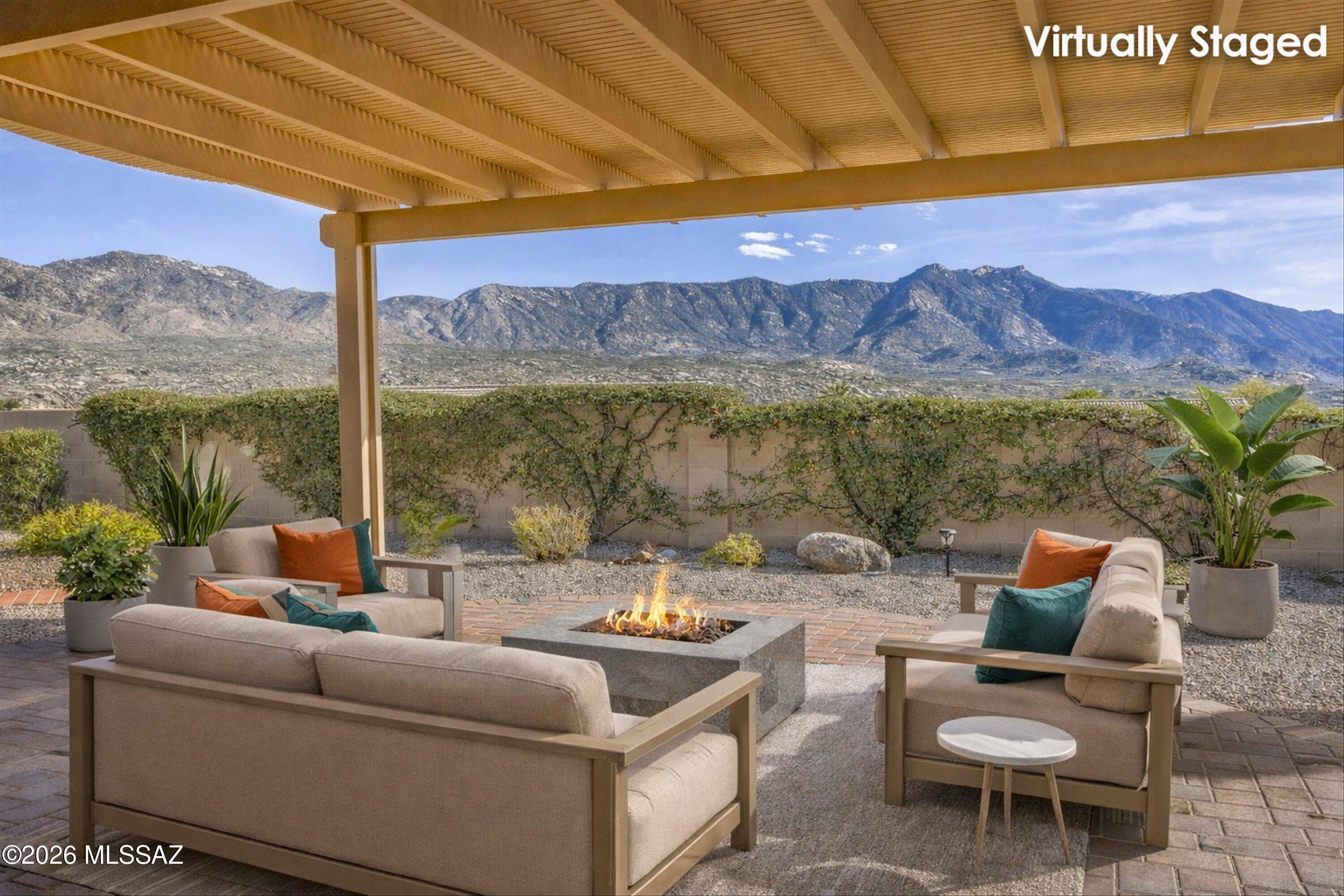 SaddleBrooke HOA1, this Estancia model captures sweeping Catalina Mountain views through expansive windows that flood the home with natural light. High ceilings and an open layout showcase the scenery from every main living space. Large kitchen features a center island, SS appliances, granite countertops, and a charming garden window, opening seamlessly to the family room—ideal for entertaining. The floor plan includes 2 bedrooms, 2 bathrooms, and a versatile den, along with a living room and dedicated dining area. The guest bath offers a walk-in shower, while the spacious primary suite boasts a large walk-in shower, soaking tub, granite countertops, and a big walk-in closet. Designed for both indoor and outdoor living, this home provides exceptional space to take in the views!