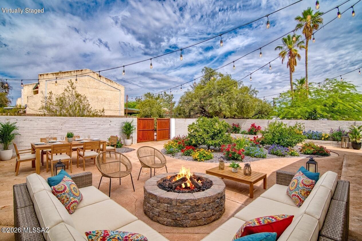 Welcome to this beautifully updated 4/2 home, perfectly situated in one of Tucson's convenient locations, just minutes from Downtown, the U of A, Reid Park & an array of shopping & dining options.
Designed for comfortable living, this home offers an impressive amount of living space featuring a generous living room, formal dining area, spacious kitchen & a welcoming family room w/ a stacked stone fireplace. 
The split bedroom floor plan provides privacy for everyone. 
The kitchen is sure to impress w/ the cabinetry & sleek SS appliances, for both everyday cooking & entertainment.
Outside, enjoy a low-maint. front & back yard w/ a fully walled backyard & an add'l fenced yard beyond, perfect for pets/play/storage. Dedicated RV parking w/ hookups, plenty of off street parking & NO HOA!