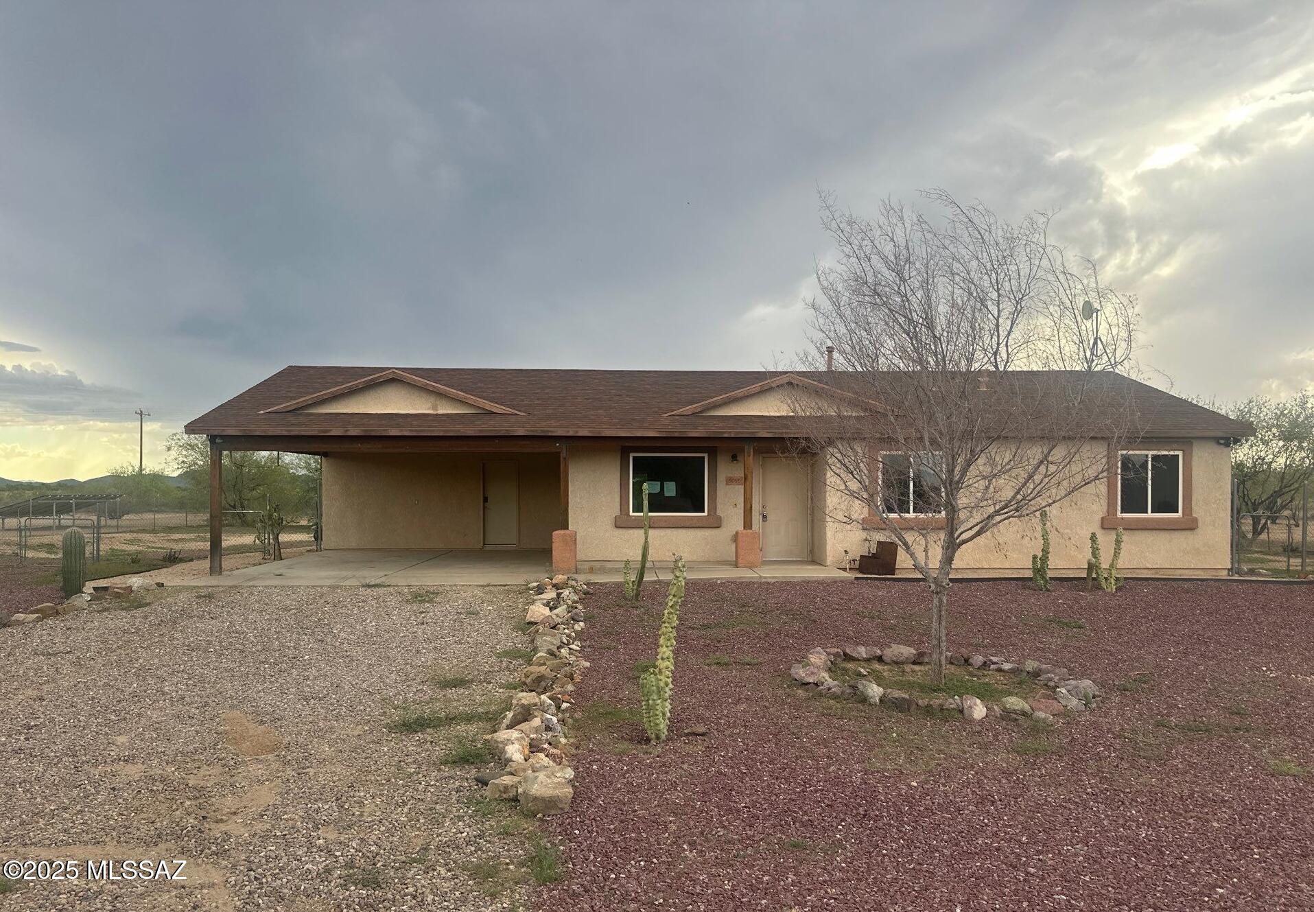 3 bed, 2 bath home with bonus room/den that can convert to a bedroom or extend the garage. Open floor plan with spacious kitchen, ample counter and pantry space. On .85 acres with fenced yard, low-care landscaping. Minutes from Saguaro National Park, Desert Museum, and an easy drive to Tucson or Phoenix.