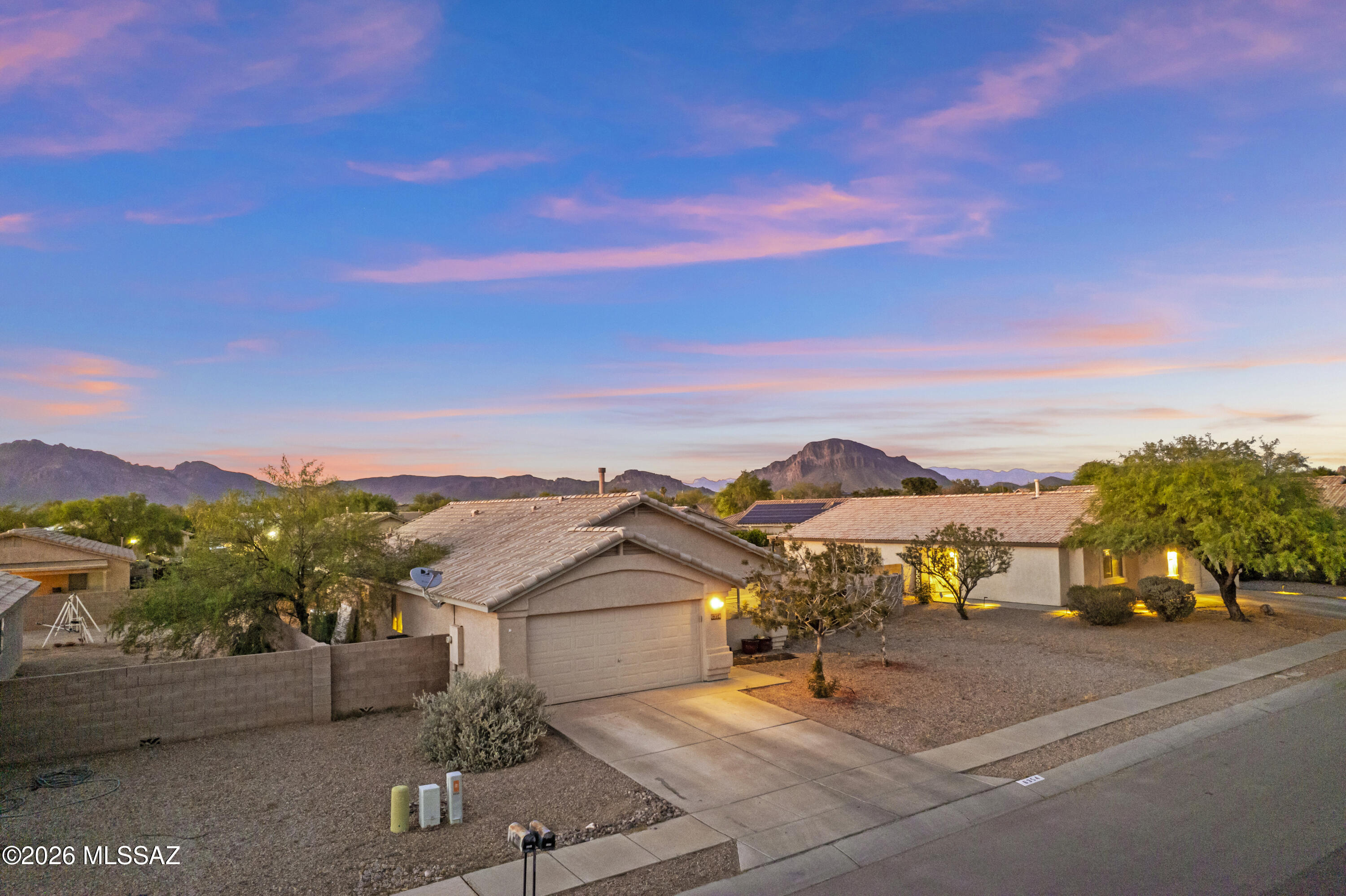 Desert sunsets, mountain views, and endless potential await in Camino Verde Estates. This Tucson home features soaring ceilings, open-concept living spaces, wood-look flooring, and a spacious kitchen with stainless steel appliances and marble-look counters. Generous bedrooms and oversized bathrooms provide flexibility, while the expansive backyard offers room to create the outdoor retreat you've been dreaming of--complete with firepit evenings under Arizona skies. Located near hiking, biking, shopping, dining, and outdoor recreation, this home combines scenic desert living with everyday convenience. Price reflects the TLC needed, creating an incredible opportunity to add your own style and value in a sought-after Tucson location. Call your agent asap for more pics and to book a showing