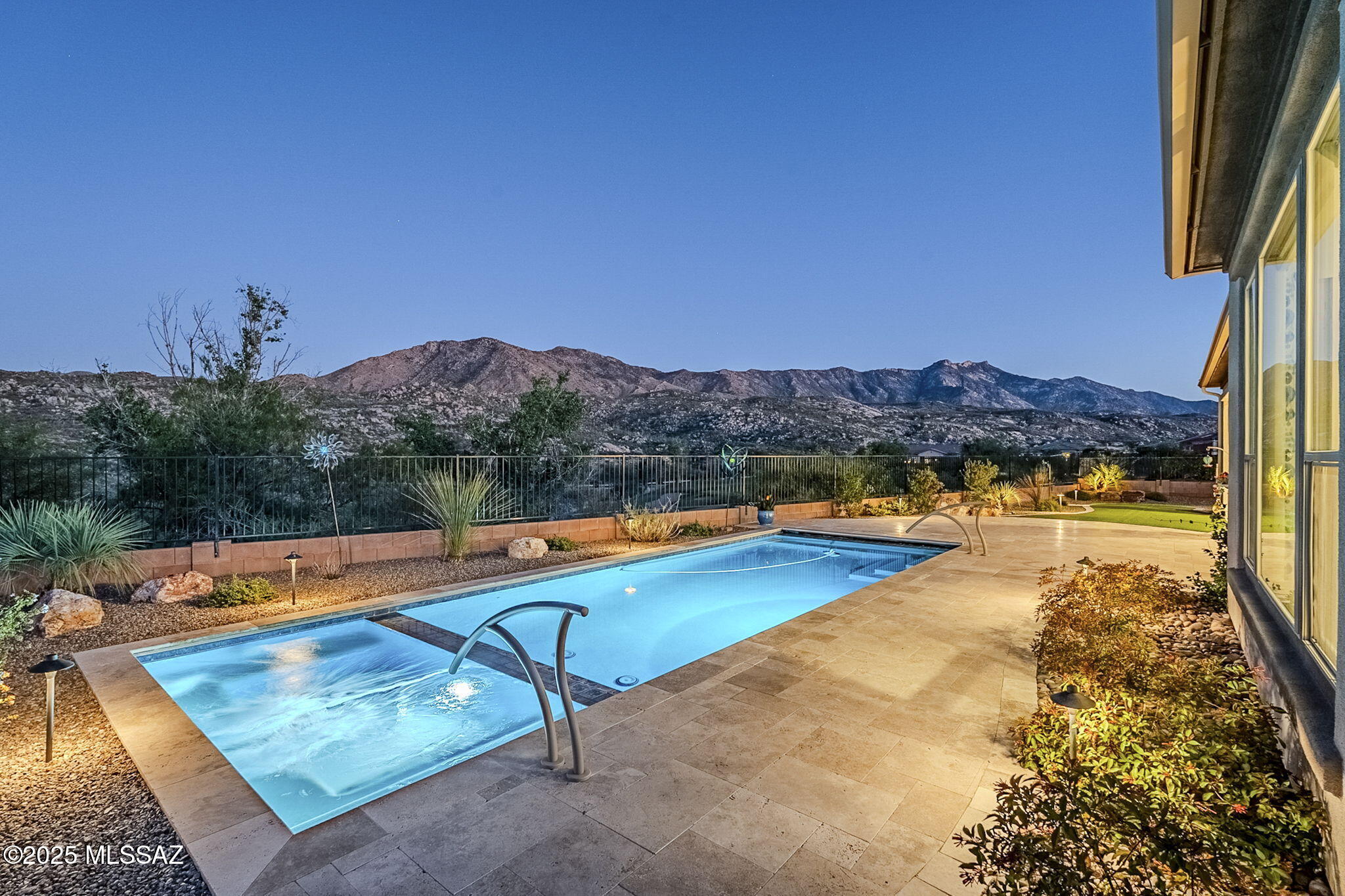 Extraordinary SaddleBrooke Preserve luxury home backing to golf and mountain views. Wolf, Sub-Zero, & Asko appliances in chef's kitchen with butler & walk-in pantries. Great room features retractable glass wall, custom built-ins in living & dining, and seamless indoor-outdoor entertaining. Primary suite offers soaking tub, split vanities, his-and-her closets, and stunning mountain views. Fabulous casita for family and friends w/kitchenette adjacent to front courtyard with fountain and private sitting area. Back patio offers endless views, fireplace, heated pool & spa, cornhole or bocce. Owned solar. Extended garage w/epoxy floor & cabinets, Tesla charger, water filtration & zoned HVAC. Beautiful landscaping & travertine pavers surround the fabulous home on a private, wide cul-de-sac lot.