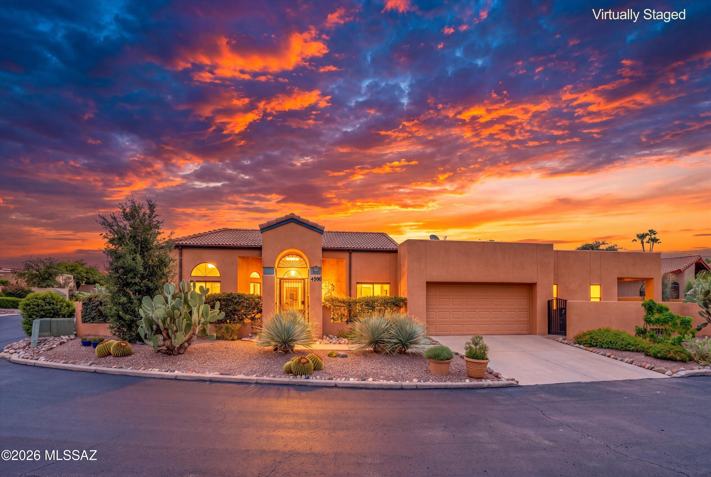 Remodeled & well-appointed townhome located in the Catalina Foothills' gated & desirable Kachina Hills community. This 2 BD/2 BA/1,814 sq.ft home offers an inviting floorplan with a spacious family room & dining area off the kitchen. The chef's kitchen features upgraded granite counters, hickory cabinets, high-end stainless steel appliances including a 60'' refrigerator & freezer, newer gas range, tile backsplash, breakfast bar & under-cabinet lighting. The spacious primary suite provides a private patio--perfect for enjoying peaceful Arizona mornings--along with a walk-in closet, custom upgraded shower, clawfoot tub & dual vanities with granite counters. Tile flooring throughout, plantation shutters, recessed lighting & replaced polybutylene pipes are just a few of the additional upgrades ....Enjoy the community pool & spa, all within the desirable Catalina Foothills. Don't miss this exceptional opportunity!
