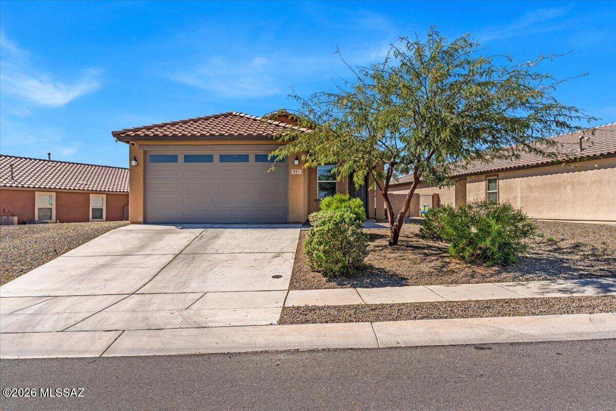 Very well-maintained, move-in ready home with an open layout.  Split floorplan with three bedrooms, den/office and two bathrooms.  The kitchen is a chef's delight and includes a gas cooktop, stylish backsplash and a large kitchen island.  Relax or entertain guests in your low-maintenance backyard featuring an extended paver patio and mountain views.  Great location near Anza Trail Park, Sahuarita Lake, multiple schools and I-19.