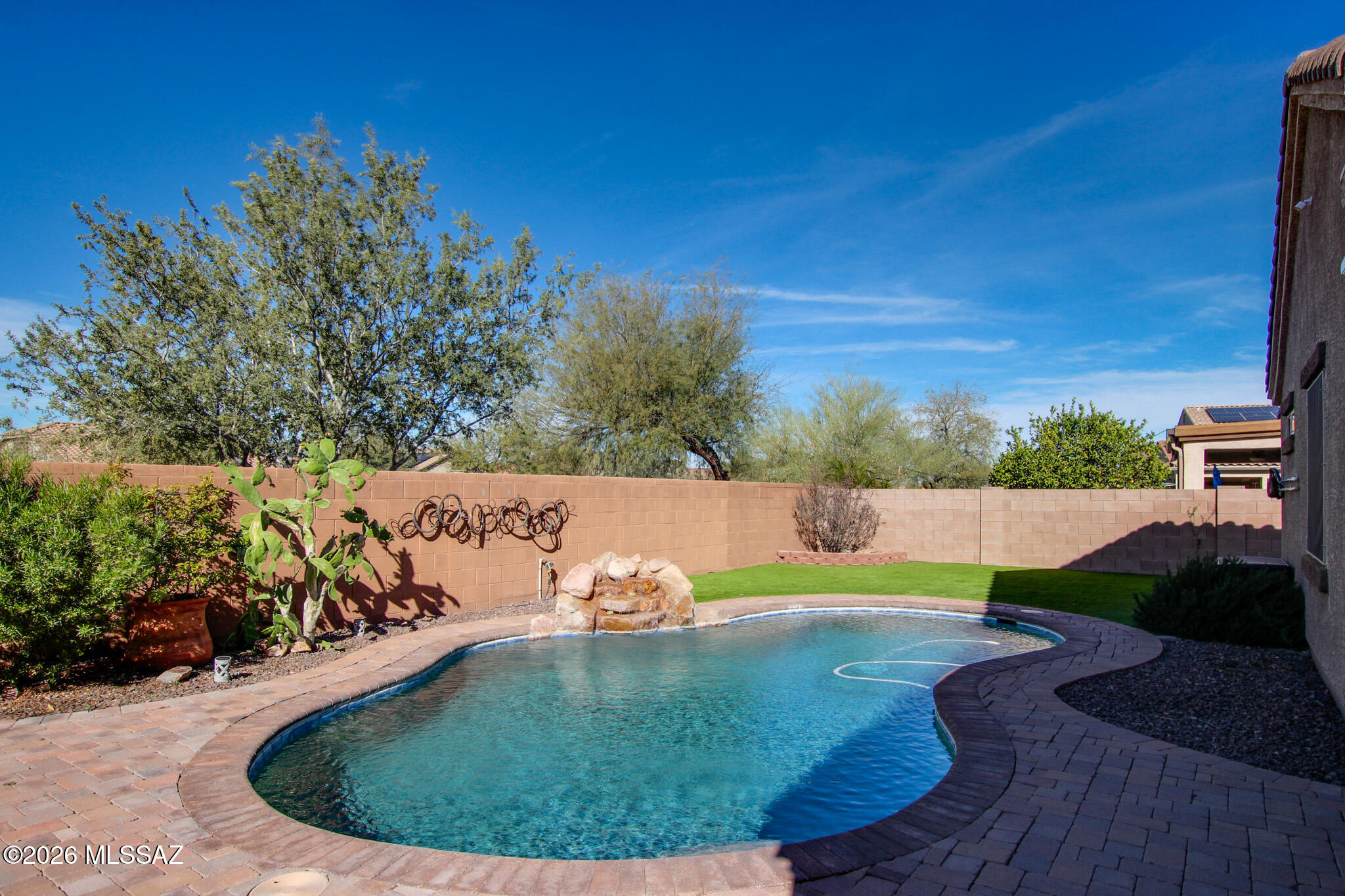 This well maintained 3-bedroom + den home features 11-foot ceilings and an open floor plan. The den offers ideal space for a home office or flex space. The kitchen includes granite countertops and stainless steel appliances. Backyard offers a sparkling pool, turf and natural rock water feature. The extended covered patio is complete with epoxy flooring and motorized sun shades.Short sale dependent on lender approval. Home is being sold as is.