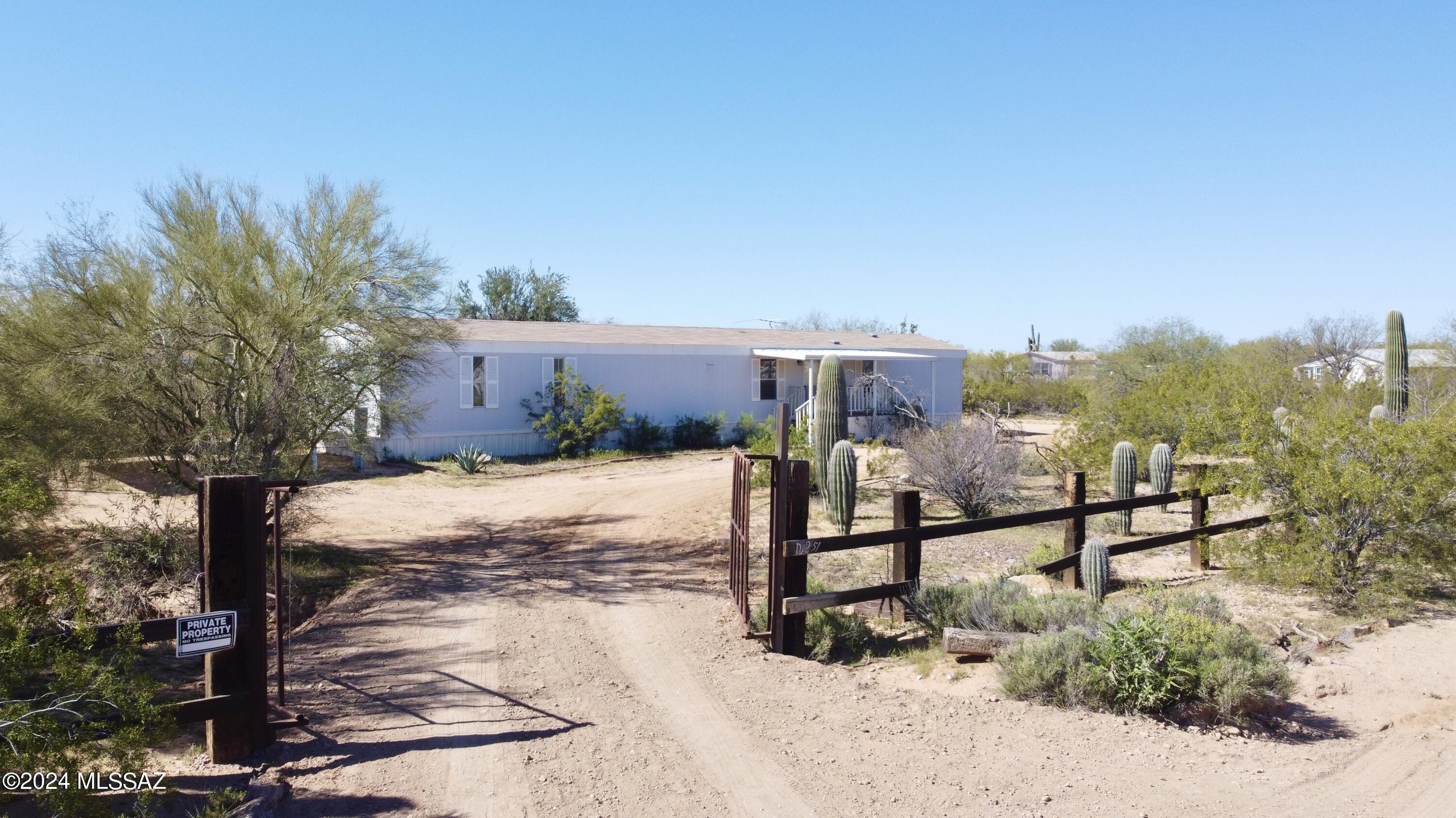 This 3 bedroom 2 bathroom home sits on 1 acre of land with no HOA! All utilities are available and connected to the home. Horses are allowed. It features a 2 car carport and storage shed on the lot. The interior features vinyl flooring, quartz counter tops, stainless steel stove and microwave, under mount kitchen sink, newer shaker style cabinetry, newer lighting fixtures, fans ceiling fans throughout, lots of natural light throughout, the master features a walk in closet, full tub, newer double vanity, framed mirrors, with modern vanity lighting, the guest bathroom features a modern vanity, framed mirror, and modern light fixture. The home has a newer HVAC unit and covered patios on front and back porch. Seller willing to finance-no bank needed. Please call for info.