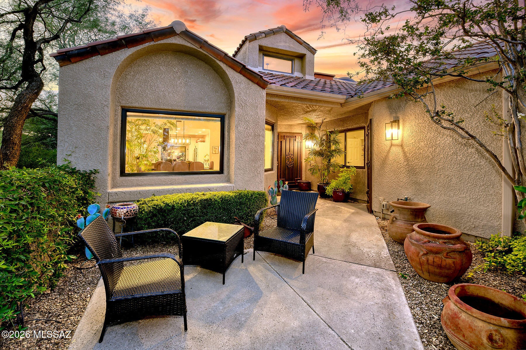 Exquisite remodeled  Golf Villa in prestigious gated Ventana Canyon. Lushly landscaped front gated courtyard, Light & open floorplan with high ceilings, walls of windows,  dramatic fireplace with floor to ceiling tile.  Designer kitchen with contemporary cabinets, quartz countertops & high end stainless appliances, lovely breakfast area, pantry, stunning tile flooring (no carpet) and beautiful fixtures throughout. Primary suite opens to private backyard patio, luxurious bath with double vanities, separate glass enclosed shower, stand alone soaking tub. Guest bedroom with private patio & Office/Bedroom #3 with courtyard view.  Enjoy the backyard featuring covered patio, stone pavers, fountain & BBQ. Lush vegetation, Community Pool & Spa, Guard gated & easy access to Ventana Canyon Country Club. Brand new $22,685 roof. Furniture is included in purchase price.