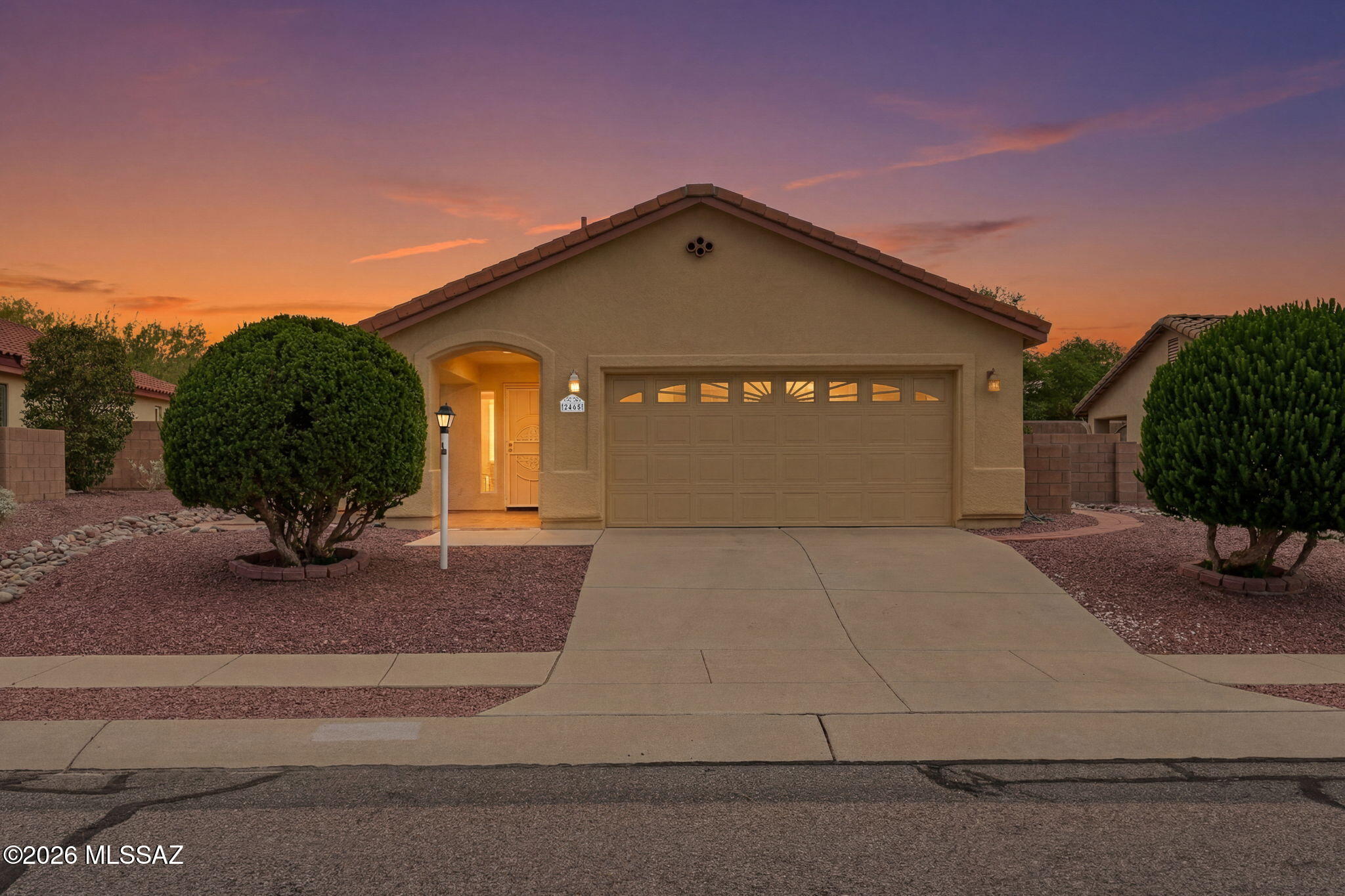 Some homes simply check the boxes. Others create a lifestyle. Enjoy life in this vibrant 55+ community with a pool, spa, pickleball courts, clubhouse, recreation room, and a full calendar of social activities--all just a short walk from your front door. This beautifully maintained 3-bedroom, 2-bath home offers the perfect blend of comfort, convenience, and low-maintenance living. The spacious kitchen features abundant cabinetry, ample counter space, a center island, and a sunny breakfast nook that flows seamlessly into the main living areas. One of the home's standout features is the expansive Arizona room, complete with its own mini-split heating and cooling system, creating comfortable year-round living space. Whether you envision a hobby room, home office, fitness area, art studio, reading retreat, or game room, this versatile space adapts to your lifestyle. The primary suite provides a peaceful retreat with an en-suite bath, while two additional bedrooms offer flexibility for guests, hobbies, or workspace needs. A dedicated storage room helps keep everything organized, and the oversized 2-car garage includes a workshop area with built-in shelving and workbench space for projects and storage. Step outside to enjoy the expansive flagstone patio and easy-care desert landscaping. Decorative lattice-lined garden beds provide the perfect framework for climbing plants and flowering vines, creating a beautiful backyard setting for outdoor entertaining or quiet evenings under Arizona's spectacular sunsets. Located close to shopping, restaurants, golf, medical facilities, and everyday conveniences, this exceptional home offers an active lifestyle in a peaceful community--with the added benefit of no GVR fees. Move in, make new friends, and start enjoying the best of Green Valley living.