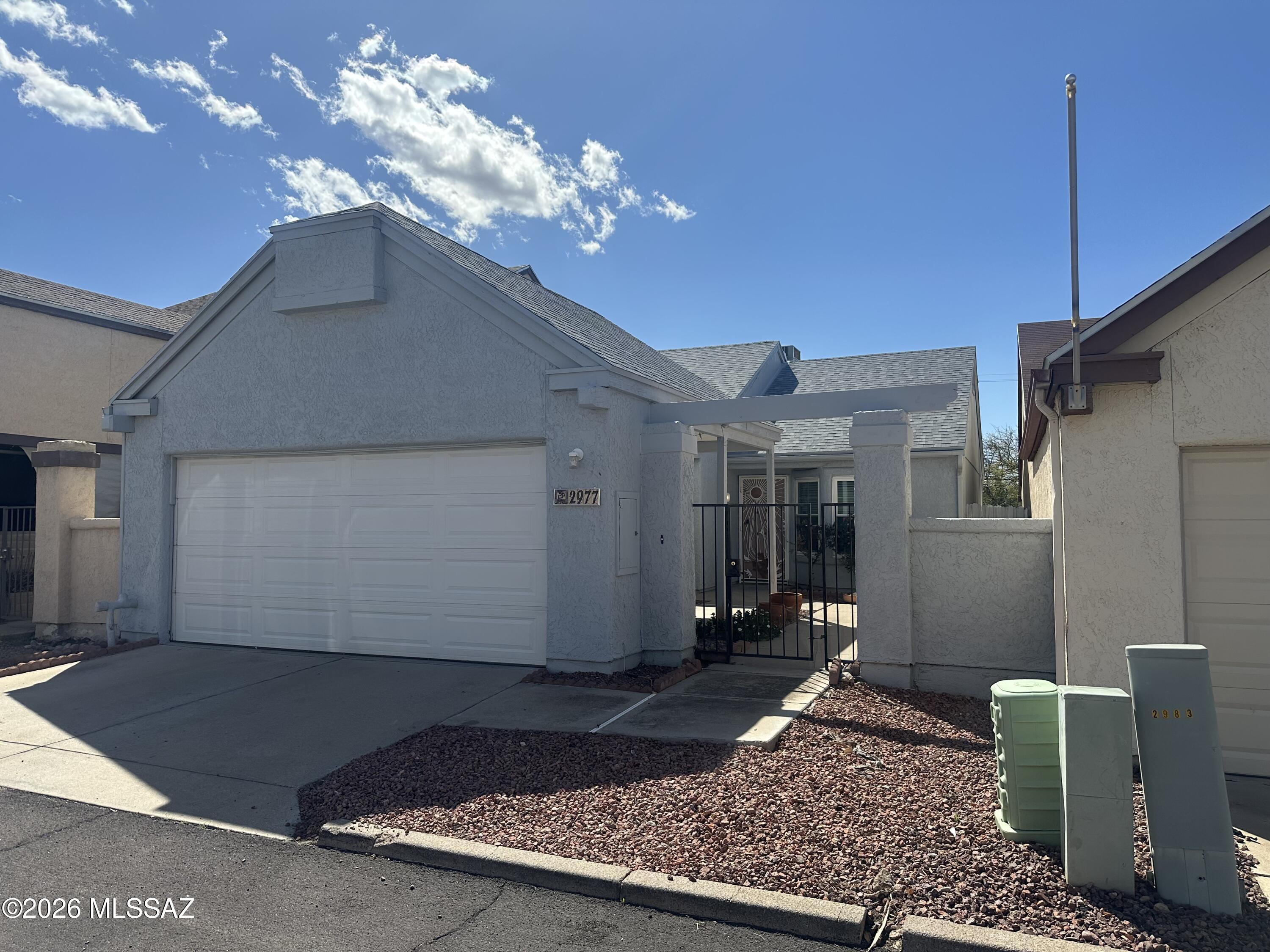Charming 2Bd 2Ba Starter Home in a Peaceful Tucson area! Welcome to this inviting home perfectly situated in a quiet, friendly neighborhood that offers the best of both tranquility and convenience. Just minutes from the prestigious Tucson Omni Golf Course, the YMCA, Pima College, and Legacy Charter, this property puts everything you need right at your fingertips--whether you're a 1st-time buyer, young family, or looking to downsize. Inside, you'll love the fresh, paint that instantly brightens every room, the dual-pane windows and patio doors deliver energy efficiency and a peaceful indoor environment. Updated lighting fixtures (including a pair of tube lights) add a contemporary touch, making this home move-in ready and easy to love from day one. Listing agent has signature authority.