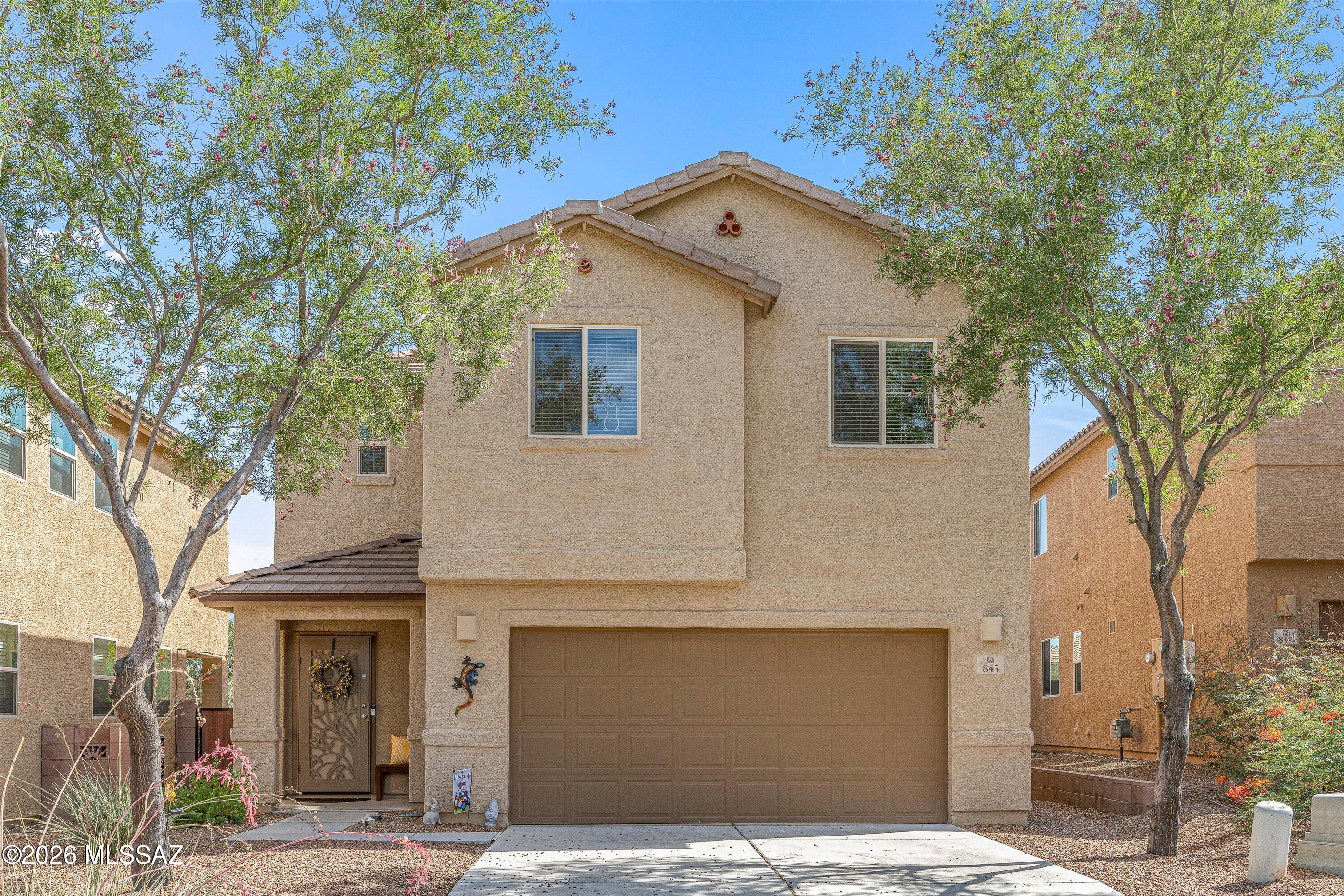 Beautiful 2-story 3BED/3BATH home in North Green Valley & Sahuarita area. The living area flows into the kitchen and dining space, creating the perfect setup for everyday living. The kitchen features white cabinetry, stainless steel appliances, island, walk-in pantry, and abundant natural light throughout. Upstairs you'll find generously sized bedrooms. The backyard offers low-maintenance desert landscaping, covered patio space, and paver walkways with plenty of room to personalize! Additional features include a 2-car garage with a manual screen enclosure and entry door, creating the perfect setup for a garage hangout, workshop space, or enjoying cool evenings with added airflow. Excellent curb appeal with mature desert landscaping. Conveniently located near shopping, dining, district! Don't miss this gem!