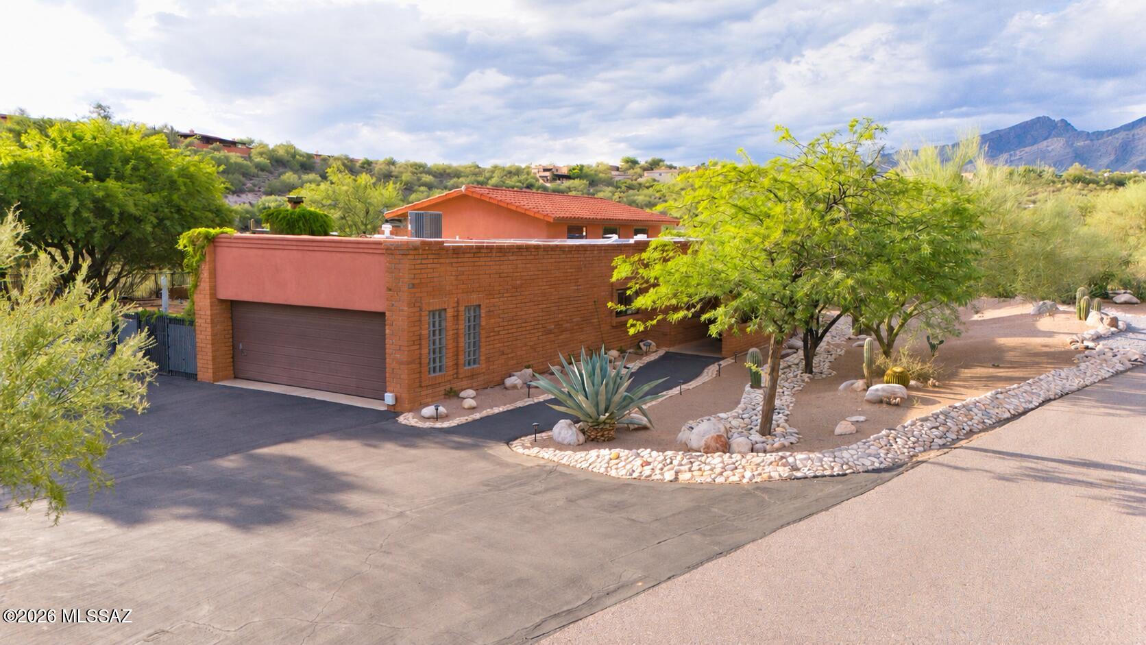 Welcome to your own Arizona retreat-where breathtaking mountain views, resort-style amenities, & effortless entertaining come together plus owned solar. This stunning 4-bedroom, 2.5 bath home plus bonus room offers an inviting layout designed for both everyday living & unforgettable gatherings. Travertine flooring flows throughout, adding timeless elegance and a touch of Southwest charm.

Step outside & discover a true entertainer's paradise, complete with a sparkling pool & relaxing hot tub, framed by spectacular mountain views. Whether you're hosting friends, enjoying a quiet evening under the Arizona sky, or simply soaking in the scenery, this home delivers the lifestyle you've been waiting for. Beautiful, spacious, and designed to embrace the best of AZ living-this is more than a hom