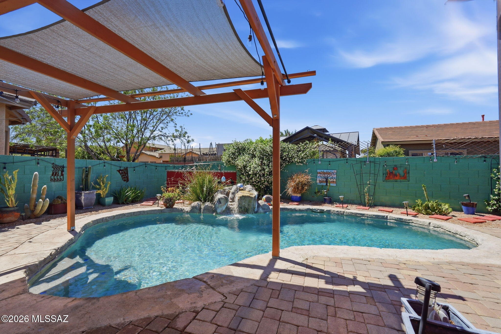 Experience resort-style living in Madera Highlands with this beautifully upgraded 4-bedroom, 2-bath single-story home with a 3-car tandem garage, perfectly positioned on a quiet cul-de-sac. Designed for comfort, efficiency, and elevated indoor-outdoor living, this move-in ready home checks every box for today's buyer.
The updated kitchen is the centerpiece of the home, featuring granite countertops, upgraded cabinetry, stainless steel appliances, and a 5-burner gas range--ideal for cooking, entertaining, and everyday living. The open-concept layout flows seamlessly into the main living areas, highlighted by a double sliding glass door that fills the home with natural light and creates a true indoor-outdoor experience. The split floor plan offers privacy, with a spacious primary suite tucked away from the secondary bedrooms. Enjoy a spa-like en-suite bathroom with dual vanities, a jetted soaking tub, separate shower, and a large walk-in closet.
Step outside to your private backyard oasis, designed for Arizona living. The saltwater pool with waterfall, extended paver patio, custom pergola, built-in BBQ center, and fire pit with seating create the perfect space for entertaining or relaxing year-round.
Major upgrades provide peace of mind and long-term value, including:
Owned solar system (energy-efficient, lower utility bills)
Newer roof (approx. 2 years old)
New hot water heater
Epoxy-coated 3-car garage floor
Located just steps from the Madera Highlands community park, featuring mature pecan trees, walking paths, dog park, playgrounds, tennis courts, and basketball courts--this home offers both convenience and lifestyle.

Don't miss this rare opportunity to own a fully upgraded home with a private pool, owned solar, and premium outdoor living in one of Sahuarita's most desirable communities.