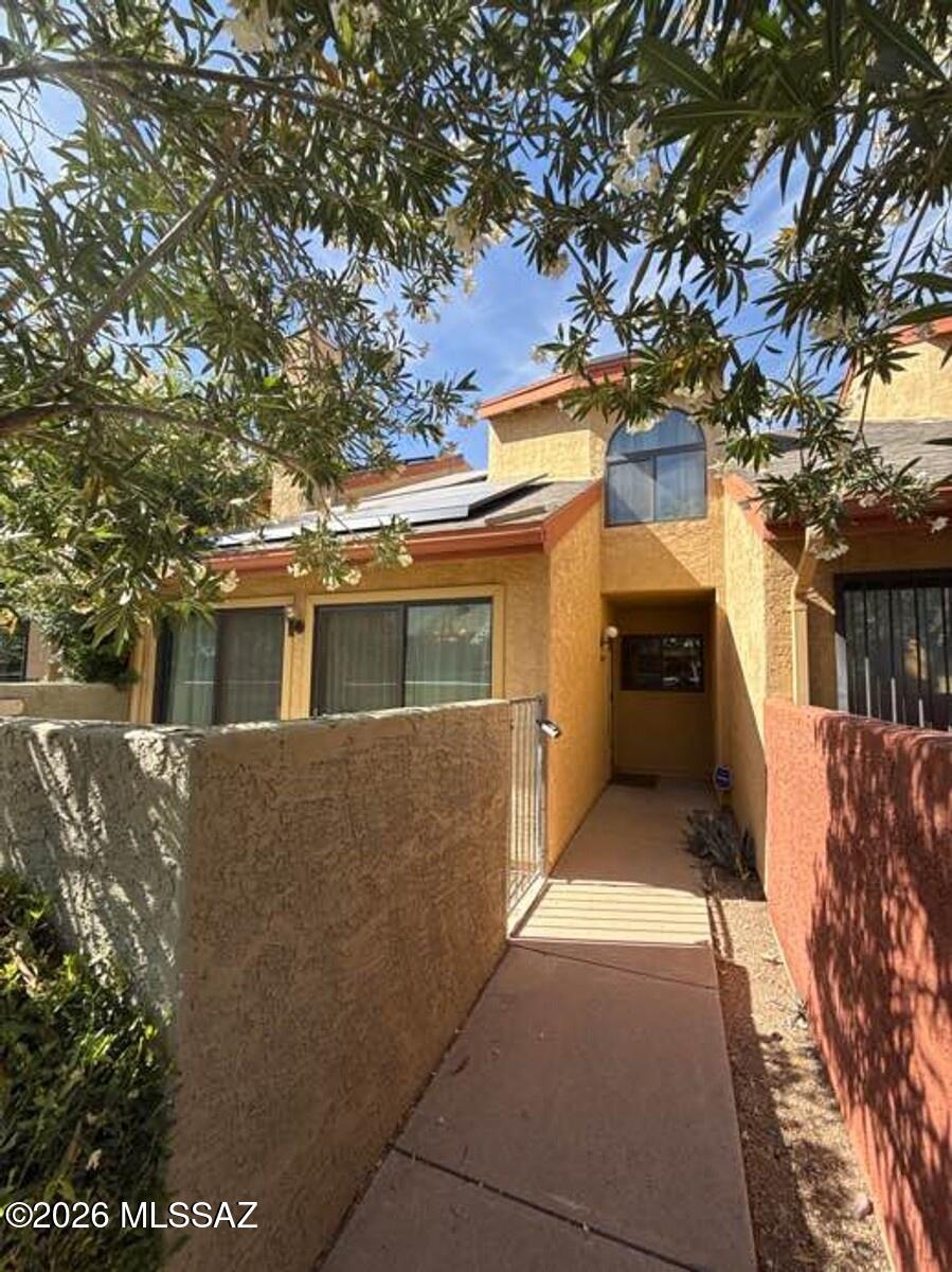 This 1,096 square foot two-bedroom, two-bathroom home in the desirable Racquet Club Village neighborhood offers comfortable living with modern conveniences. The kitchen comes fully equipped with essential appliances including refrigerator, dishwasher, microwave, and oven, providing everything needed for daily meal preparation. The open living areas feature natural light and a thoughtful layout that maximizes the available space. Both bedrooms offer comfortable accommodations, while the two full bathrooms provide convenience for residents and guests alike. The home includes an in-unit washer and dryer for added convenience, eliminating trips to a laundromat. A single-car garage provides secure parking and additional storage space. The property features central air conditioning to keep you comfortable during Tucson's warm seasons. Located in Racquet Club Village, residents enjoy a well-established neighborhood setting with easy access to local amenities, shopping, and dining options. The location provides convenient access to major Tucson thoroughfares for commuting throughout the metropolitan area. This home combines practical living spaces with desirable neighborhood amenities, making it an excellent choice for those seeking comfortable rental living in Tucson.