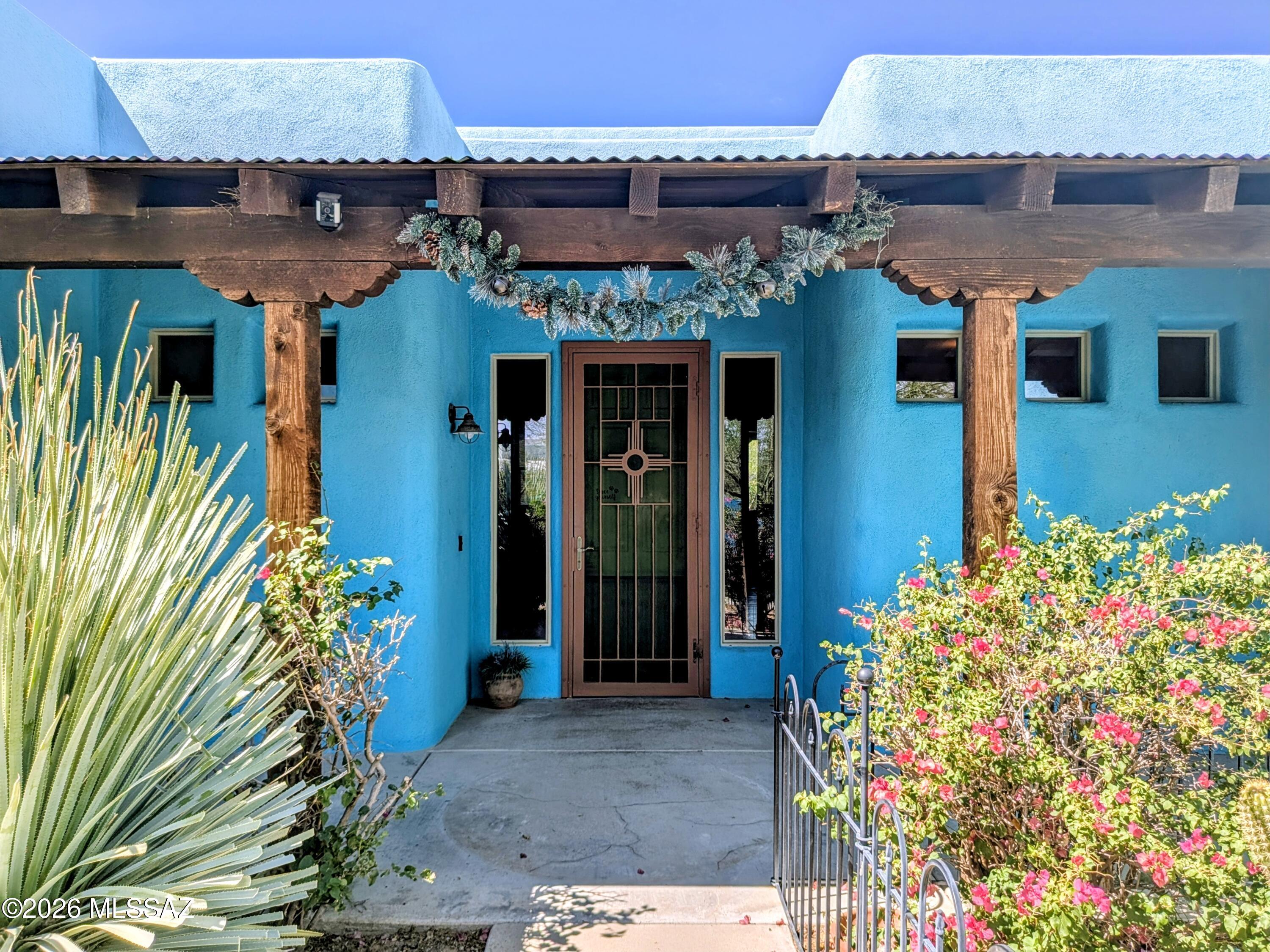 Welcome to a truly one-of-a-kind desert retreat where art, nature, and tranquility come together beautifully. This stunning artists home is filled with colorful walls, gorgeous wood high ceilings, and an abundance of natural light that creates a warm, peaceful feel throughout. The tranquil courtyard invites quiet mornings, relaxing evenings, and a true connection to the surrounding desert landscape. A custom-built sweat lodge adds a rare and meaningful touch, creating space for rest, reflection, and renewal. This property feels like living at a private nature lovers resort, peaceful, soulful, and full of character.