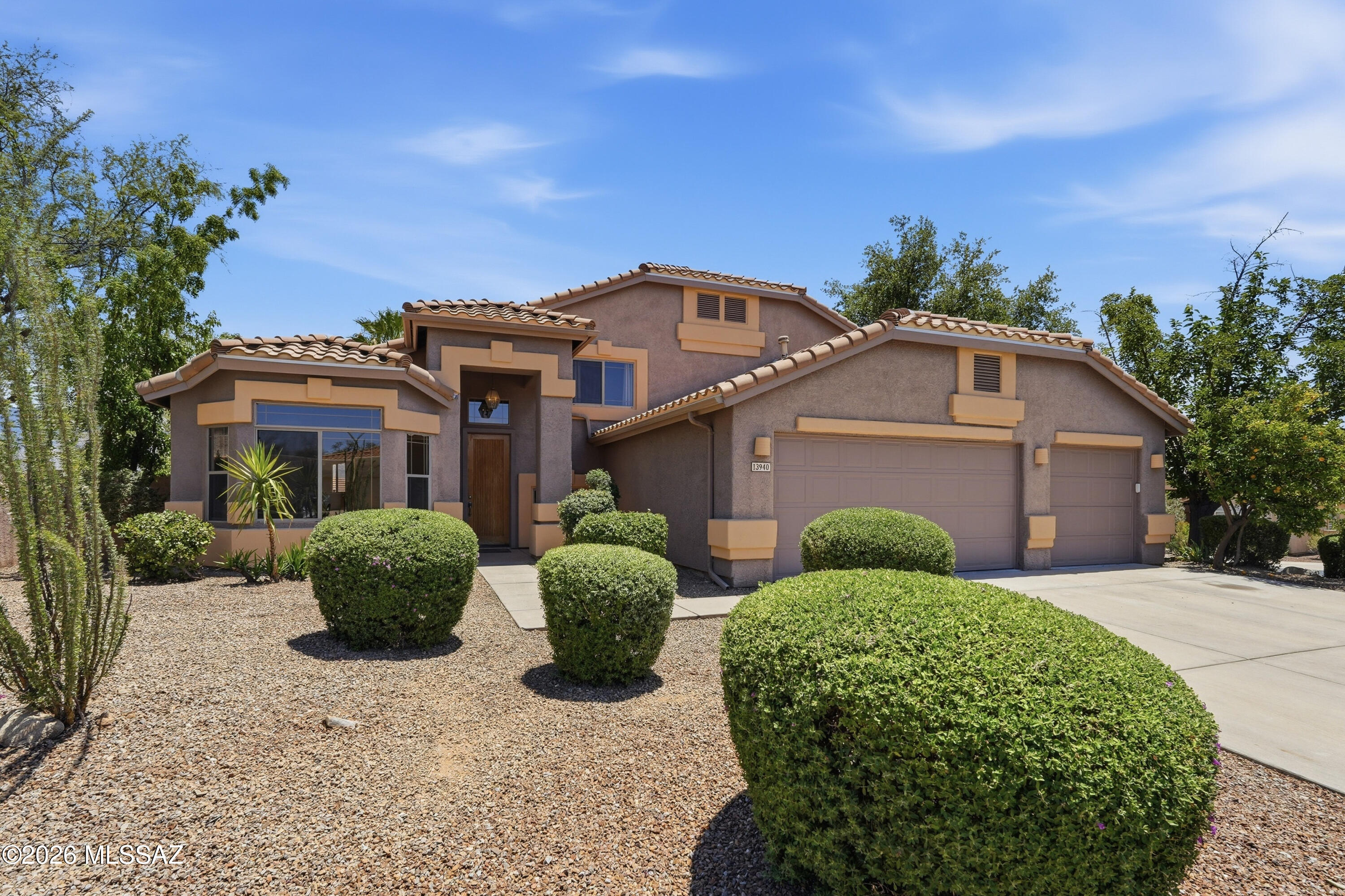 Beautiful ,Large Home with Amazing views in the heart of Oro Valley. This 5 BR, 3 BA property has 3354 Sq Ft of living space. It sits on a large corner, view  lot. Enjoy a nice sized backyard with an inviting patio, a sparkling POOL, shaded ramada, mature citrus trees & sweeping views of the Catalina Mountains. The main level of the home has formal  living/dining, an oversized eat in kitchen w/granite counters, double ovens & a large island. Step down into a huge family/den area with fireplace. The master suite offers a private balcony with stunning mountain views. Beautifully maintained with recent updates including: New roof (2026), New complete HVAC system (2023), New water heater (2026) See attached list of upgrades. AND close to great schools, shopping, hiking and more