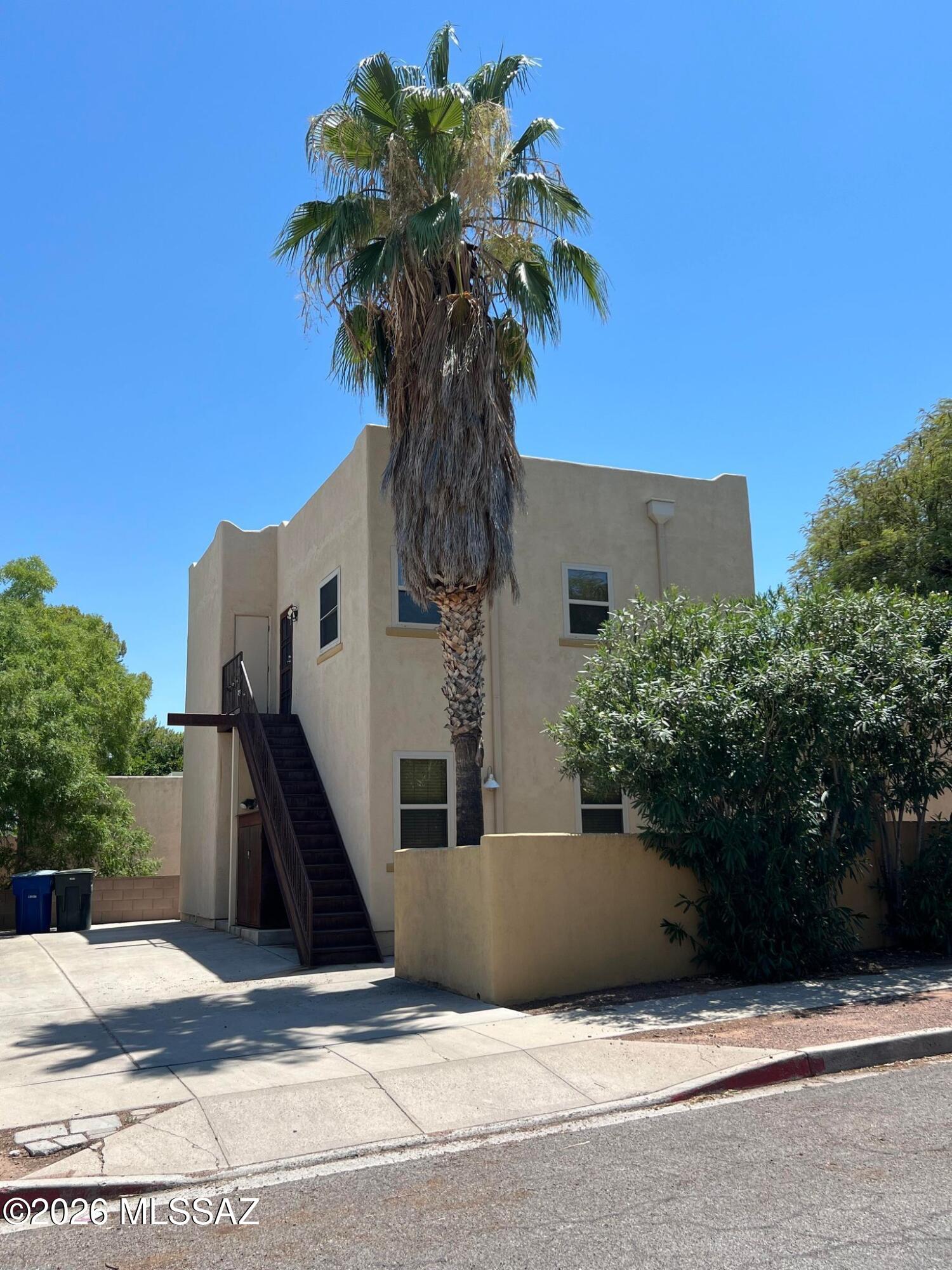 Gorgeous 2 bedroom, 1 bathroom end-unit triplex located directly across the street from the University of Arizona, offering approximately 745 sq. ft. of comfortable and convenient living space. This bright and well-maintained home features vaulted ceilings, tile flooring throughout, and an open layout that feels spacious and inviting. The kitchen includes a refrigerator, stove, and oven, while the bathroom offers a double sink vanity for added functionality. Enjoy year-round comfort with air conditioning, ceiling fans, and heating. The home also includes a full-size washer and dryer on site, window coverings, and one off-street parking space. Perfect for students or anyone wanting to live close to campus. Available July 10th. Please do not disturb current tenants. No pets allowed.