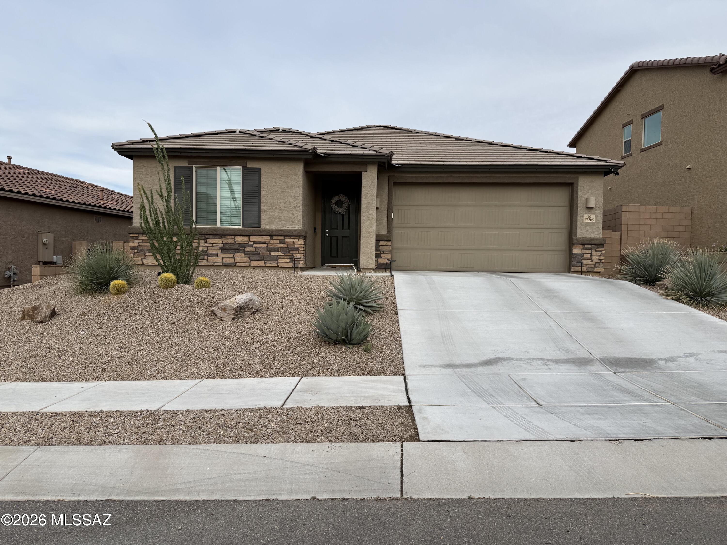 Beautifully upgraded 3 Bedroom plus Den in Santa Rita Ranch III. Impressive Foyer has ample feature wall space to showcase decor, artwork and photos. Open Great Room, granite Kitchen, sink in lg island, and Dining area. Pantry closet. Refrig incl. Plus, a den/study, or playroom!  Split layout for extra privacy. King-sized Primary Bdrm and spacious ensuite. Dual sinks, granite counter, full shower, walk-in closet. Bedrooms 2 & 3 are separated by Guest Bath. Tub/shower and single vanity. Laundry Rm - washer & dryer incl. Convenient hallway key drop. Plank ceramic tile floors/carpeted bedrooms & den. Cov Patio, pavers & turf. Overhead garage storage. Well maintained and clean. Elevated lot. Fully landscaped. Walk to park with playground, basketball, ramada, tables, & grass field. Vail schools
