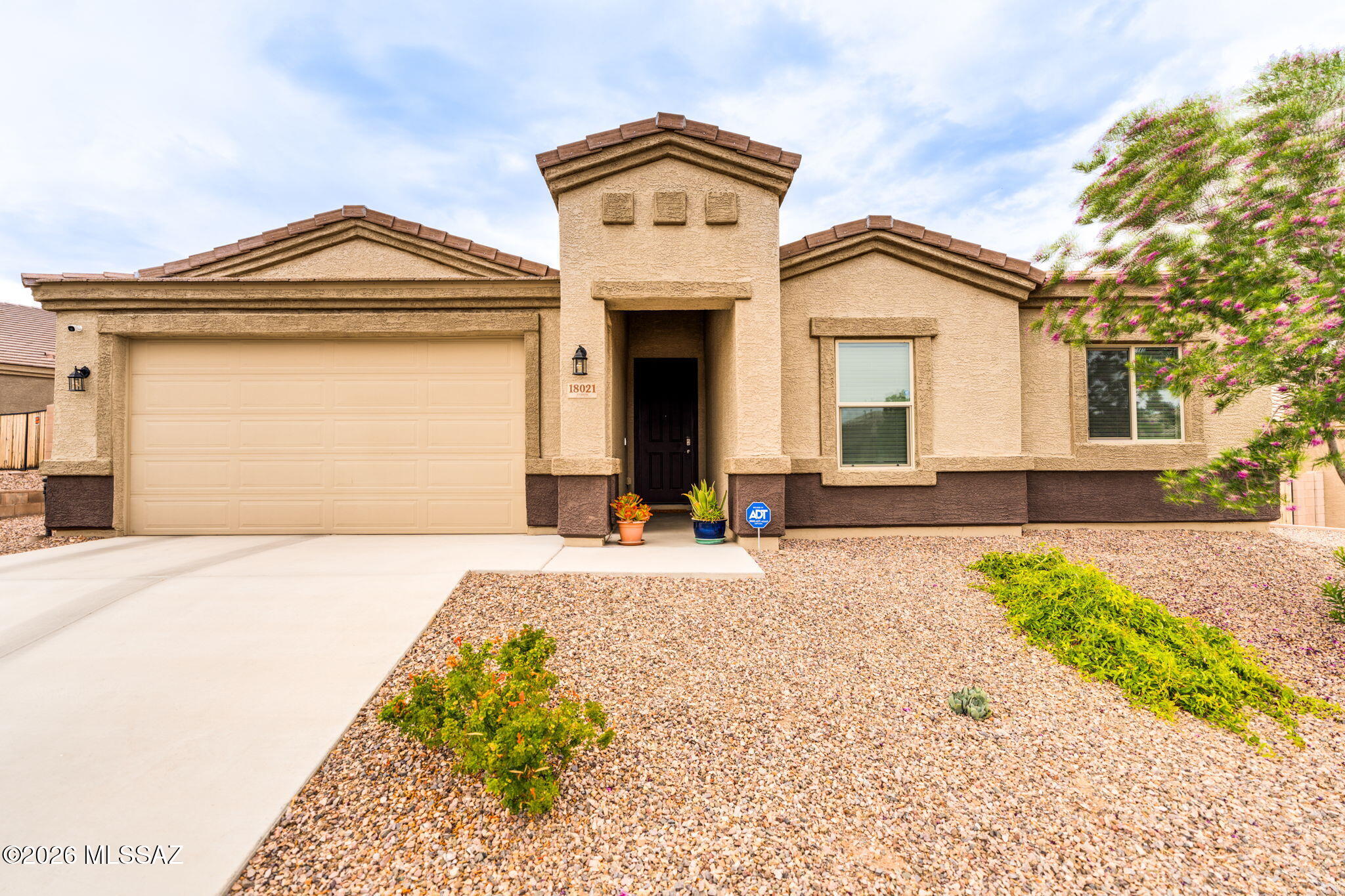 Better than new 3 Bed/2 Bath single story home with over $15K in landscaping (premium lot) and interior upgrades. Well maintained, open floor plan, neutral colors throughout with all Whirlpool stainless steel appliances included. Large Primary Bedroom and 2 walk-in closets in the primary bathroom!  Enjoy  the Santa Rita Mountain views from beautifully landscaped back yard.  Existing DR Horton Builder Warranties on Structural, Roof and Carrier HVAC will transfer. Built in Safe Haven smart system unit and a separate ADT system. American Home Shield warranty to convey.