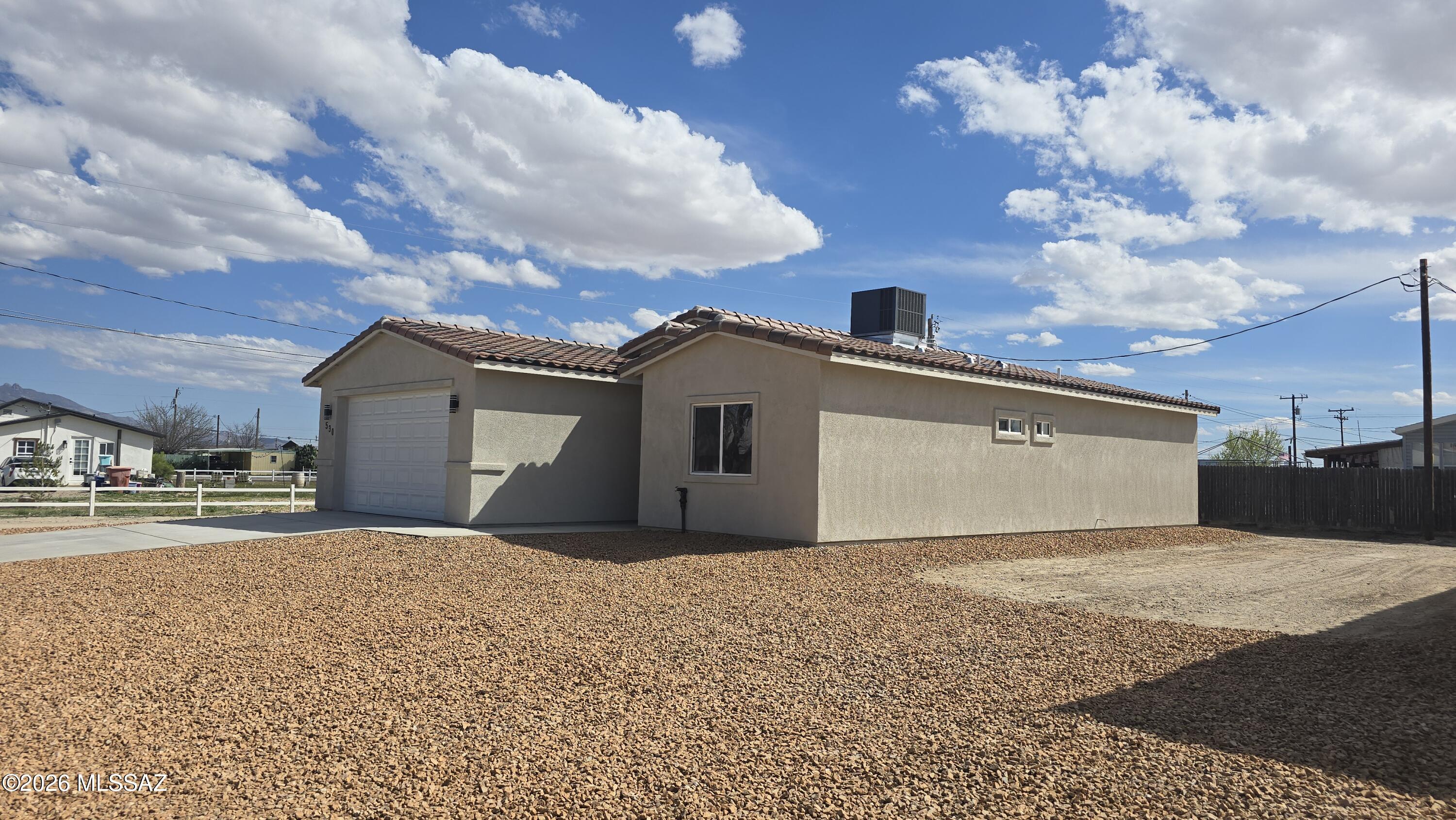 Introducing a stunning new construction in a tranquil residential neighborhood of Willcox, Arizona. This modern 3-bedroom, 2-bath home blends style, comfort, and quality craftsmanship to create the perfect southwest retreat. The residence features an open, light-filled floor plan designed for easy living and entertaining, with tile throughout for a clean, low-maintenance aesthetic. Marble countertops add a touch of timeless elegance, while the primary suite offers a generous walk-in closet. Built with premium finishes and quality construction, this home includes a 2-car garage for convenient storage and parking, and features a beautiful, classic, Southwest tile roof that adds curb-appeal and durability. Located in a welcoming Willcox neighborhood, this move-in-ready property combines modern ease with classic charm in a price-conscious package for new construction. Don't miss your chance to own a stylish, energy-efficient home in a growing Arizona community.