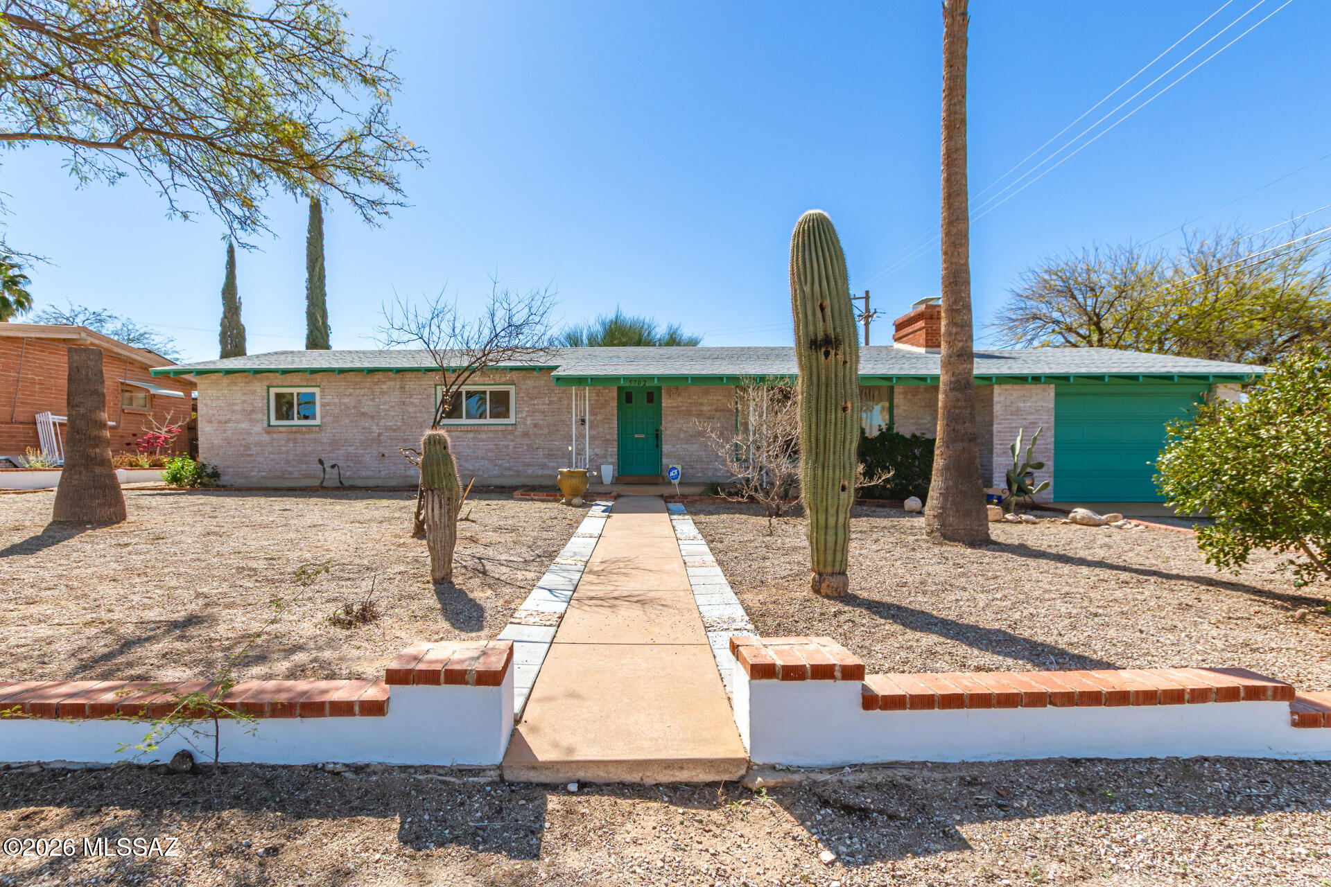 Catalina Mountain Views Under $400K -- Yes, Really.

Welcome to 5702 E 6th Street, where mid-century charm meets meaningful modern upgrades in the heart of central Tucson.

From the moment you walk into the living room, your eyes are drawn to the large picture window, which frames breathtaking views of the Santa Catalina Mountains. Natural light pours in, and the mountains create a stunning daily backdrop--the kind of feature buyers search for and rarely find at this price point.

This 3-bedroom, 2-bath home has been thoughtfully refreshed for today's lifestyle. The kitchen showcases sleek quartz countertops and updated finishes that blend beautifully with the home's original character. The hall bathroom has been completely renovated with a clean, modern design, giving the interior a polished move-in-ready feel. A whole-house water softener adds everyday comfort and long-term value -- a smart upgrade for Tucson living.

Step outside to a backyard designed for gathering and entertaining, featuring a beautifully built BBQ area with its own fireplace -- perfect for cool desert evenings. Rear alley access provides added convenience and flexibility.

Offered at $394,900, this home delivers mountain views, updates, character, and location -- all in one compelling package.

Homes with Catalina views under $400K in central Tucson don't last.