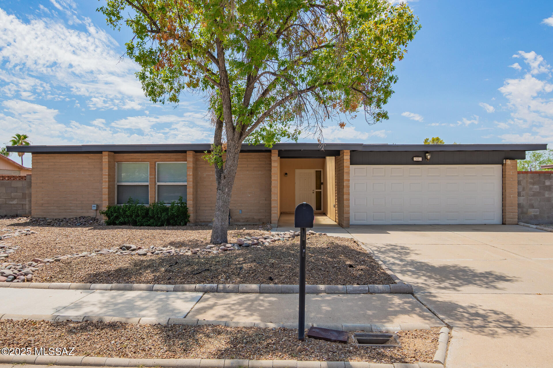 This 3-bedroom gem with a 2-car garage and RV gate is waiting for you! Gather in the inviting living room, where a cozy corner Kiva fireplace sets the mood for unforgettable moments. You'll love the wood-look floors, vaulted ceilings, and family room. Kitchen is a treat with skylights, granite counters, stainless steel appliances, wood cabinetry, a serving window to the family room, and a breakfast bar. Retreat to the main bedroom featuring a private bath and walk-in closet. Bonus points for the AZ room, complete with skylights, tile floors, and even a mini stage that's ready for your next party! Backyard offers plenty of room for a pool, barbecue, or simply soaking up the sunshine. All this, just minutes from schools and local favorites. Make it yours now!