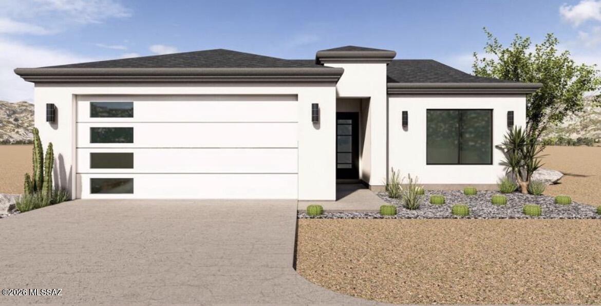 Welcome to this beautifully crafted modern new construction home, offering 1,464 square feet of thoughtfully designed living space. Located just minutes from I-19 via the Ruby Road exit, this home combines convenience with contemporary elegance.Step inside to an open concept floor plan featuring ceramic tile throughout for a clean, cohesive look. The custom white kitchen is a true showstopper, complete with stainless steel appliances, soft-closing hinges, a spacious pantry, and stunning granite countertops, all illuminated by modern light fixtures that elevate the space. The primary suite is generously sized, featuring a walk-in closet and a large tiled shower for a spa-like experience. The guest bathroom offers a dual vanity, ideal for family or visitors. Additional highlights include a dedicated laundry room, a covered patio perfect for outdoor entertaining, and a very usable lot ready for your personal touch. Constructed with upgraded synthetic stucco and topped with a sleek black double-layer shingle roof, this home blends style and durability in a desirable location.Don't miss the opportunity to own this move-in ready modern gem!