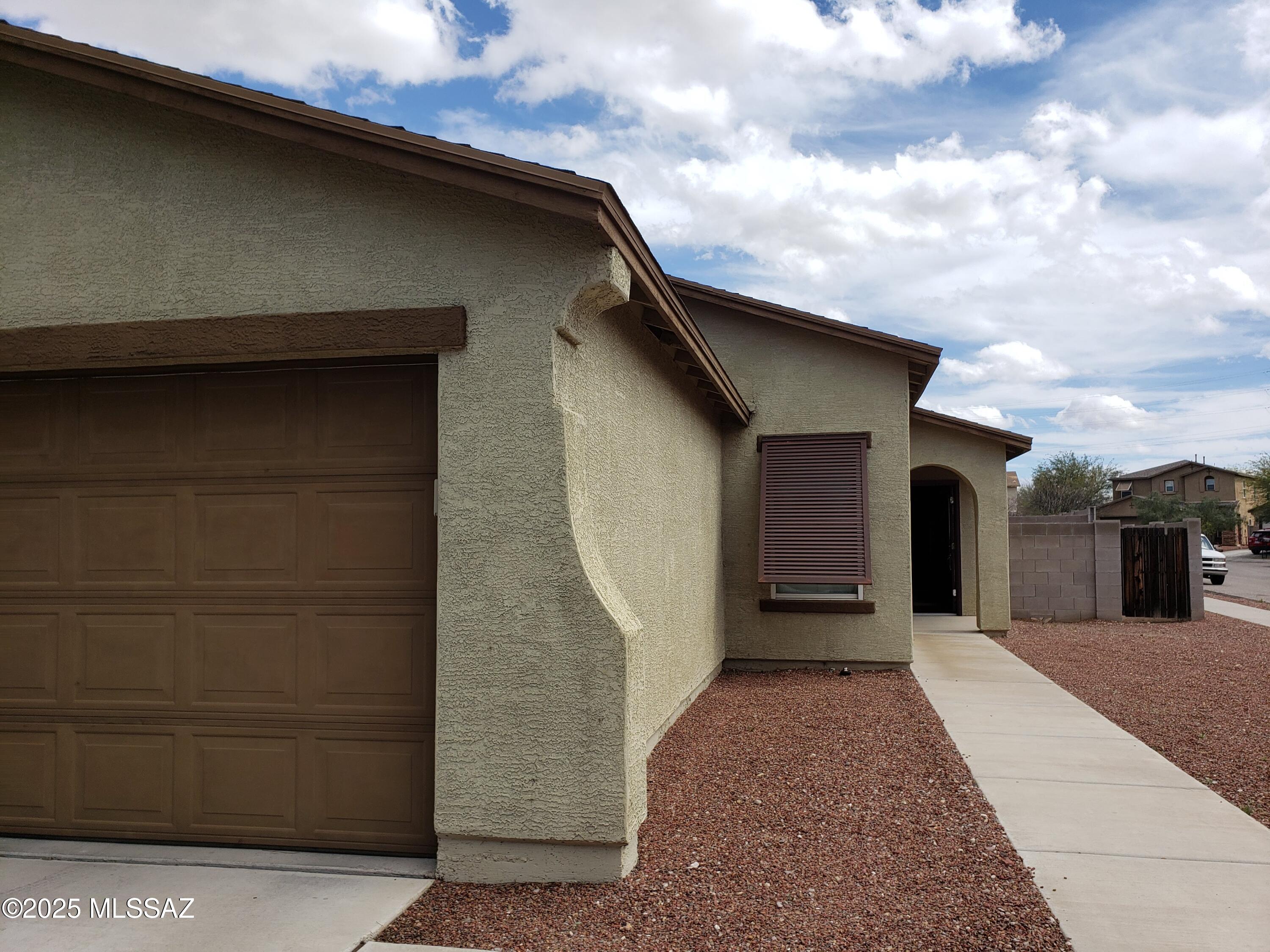 3br/2ba home close to the freeway, Davis Monthan AFB, Tucson Airport, downtown, Raytheon and the new Amazon and Home Goods centers. Great room living room with ample counter-space in kitchen. No carpet! Tiled floors throughout, walk-in closet in primary bedroom, 2 car garage and big fenced in yard. Large corner lot with covered patio. Call today! Tenant occupied until 05/31/2026