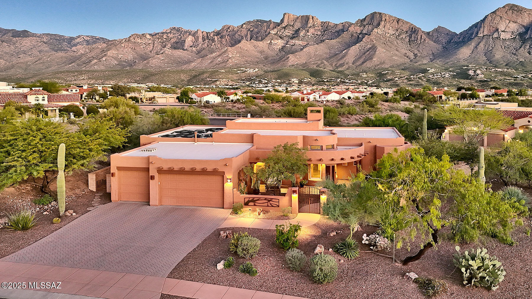 One of the Best Luxury Homes you'll see in Oro Valley this year, on the lot you've been waiting for. Unobstructed Pusch Ridge Views, Private & Serene.  You'll love the New, Paved Naranja Dr. Multi-use Path for Walking, Jogging & Biking.  Refined SW Contemporary Design tied together in a Light-filled Floor Plan, Lofty Ceilings, Expansive Windows, Slate Floors and No Interior Steps.  Gorgeous Kitchen lined in Custom Mesquite Cabinetry and Handsome Granite Counters.  Easy transition from Great Room to Superb Outdoor Living, Covered Patio, Solar Heated Pool & Spa, Outdoor Bar & Grill, and Easy-care, Professionally Landscaped Yard.  Deep Setback, Spacious Driveway and Gated Courtyard.  Formal Entry and Secluded Master Suite w/Garden Tub & Walk-in Shower.  A Meticulously Maintained Dream Home.
