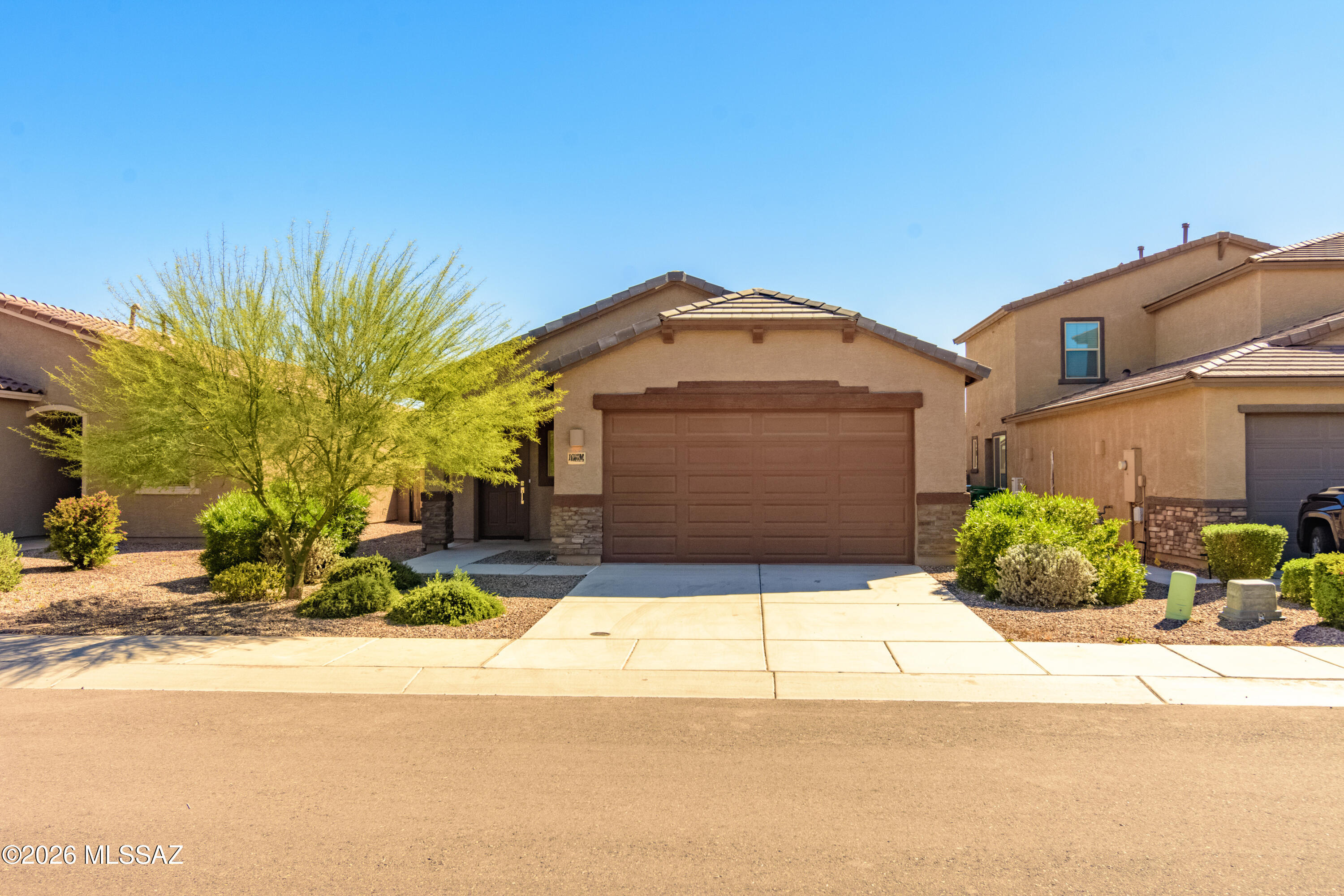 Like-new and beautifully designed, this 4-bedroom, 2-bath contemporary home in the highly sought-after Gladden Farms community offers the perfect blend of comfort, style, and functionality.
Step inside to a thoughtfully crafted split-bedroom floor plan that creates both privacy and flow. The heart of the home features an open-concept kitchen and great room--ideal for entertaining, gathering, and everyday living. Natural light fills the space, creating a warm and inviting atmosphere from the moment you walk in.
The front wing of the home offers three well-sized bedrooms and a spacious hall bath with dual sinks--perfect for family, guests, or a home office setup. Tucked away in the back for added privacy, the primary suite serves as a true retreat, complete with a dual-sink vanity, walk-in closet, private toilet area, and a separate shower designed for relaxation.
Step outside to a low-maintenance backyard with room to enjoy Arizona living year-round.
Whether you're hosting, unwinding, or simply enjoying the comfort of home, this property delivers a seamless balance of modern living and everyday convenience--all in a vibrant, desirable community.

Welcome home.