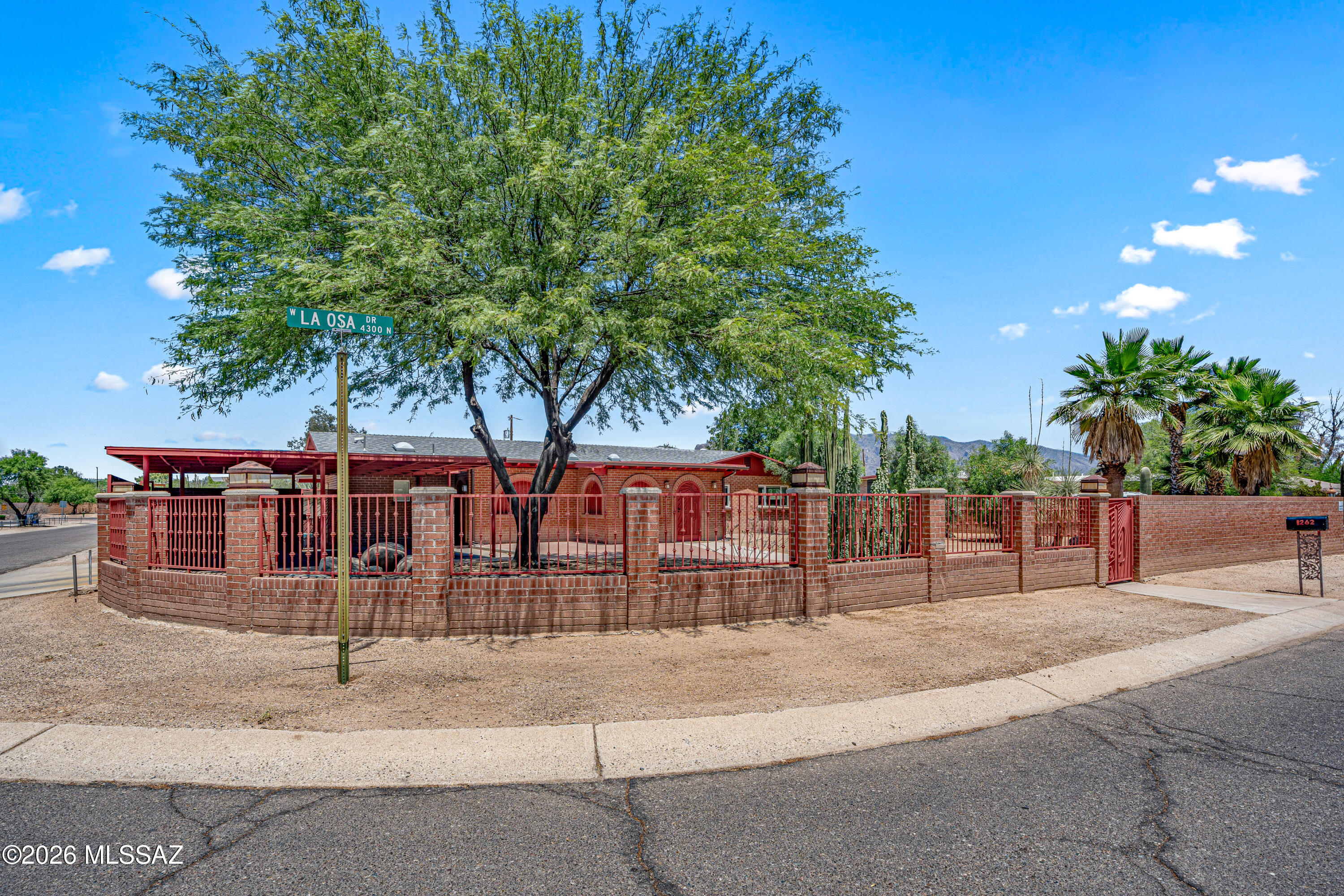 Awesome SOLID wire cut red brick home on a .37 acre (completely PRIVATE walled in  (front & back yard) corner lot. New roof (over $17,000) & sparkling newly re-plastered pool. Two enclosed Arizona Rooms equal approximately 543 sq. ft  potential additional live-able square footage. Nice kitchen with granite countertops and stainless steel appliances, HUGE primary bedroom w/ensuite bathroom, split bedroom plan ++. Lot has the potential to be split and back sold off or have a secure place to park all your toys and vehicles, with multiple drive-through gates. Versatile MU zoning & Just down the road from the Tucson Mall & Tucson Auto Mall. Excellent Access to I-10. Please allow 4 days for Seller to respond to offers. No SPDS. Estate Sale. HOMES LIKE THESE RARELY COME AVAILABLE!