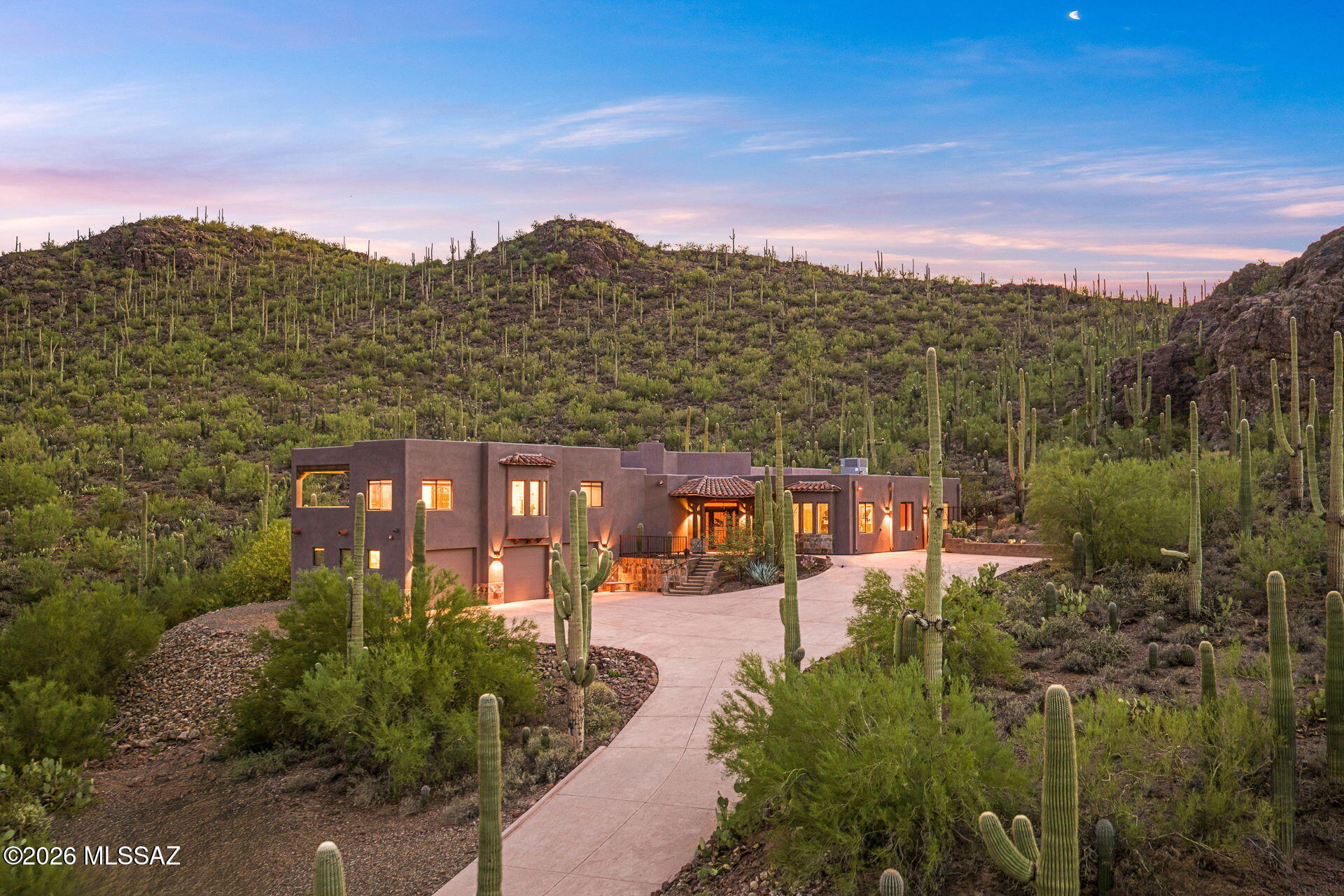 Privacy, Views & Desert Living! Discover a truly special custom home nestled on 3.3 private acres in the Tucson Mountains. This gated property offers an incredible sense of seclusion while capturing panoramic views, stunning mountain vistas, and sparkling city lights.

Beautifully maintained and updated, this home blends timeless Southwestern character with modern comforts. The spacious great room features wood-beamed ceilings and expansive windows that showcase the breathtaking surroundings. The gourmet kitchen was refreshed in 2024 with all-new GE Slate appliances, including refrigerator, dishwasher, oven, stove, and vent, with a matching microwave.

Recent improvements provide added peace of mind, including two HVAC systems replaced in 2024, with transferable 15-year warranty, roof inspected and coated in 2026, and fresh exterior paint in 2026. With its gated setting, surrounding Saguaro wilderness, panoramic views, pool, this is a rare opportunity to own a wonderful Tucson Mountain property.