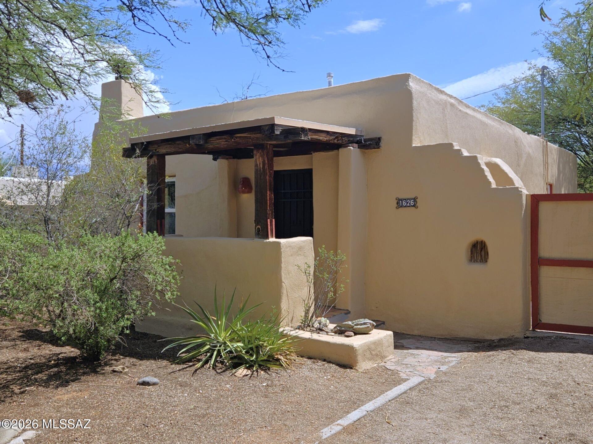 Opportunity to own a piece of Tucson history in Blenman, one of its most beloved historic neighborhoods.  Southwest Pueblo Adobe home is quaint, rustic, full of personality! Beamed ceilings, archways, Mexican pavered floors. Just repainted, newly finished tiled porch and backyard trellis patio.  Dual-paned windows, inside supply lines and water heater replaced in 2018.  200' deep lot provides exceptional backyard space, endless possibilities for serious gardening, future expansion and ADU. 2 sheds, upgraded closeline, who needs a dryer!  Just a short stroll to Blenman Elementary School, minutes to the U of A, Banner University Medical Center, dining, shopping and just 8 blocks to the Arizona Inn.  Historic property tax break in place for owner occupant. Seller to provide home warranty!