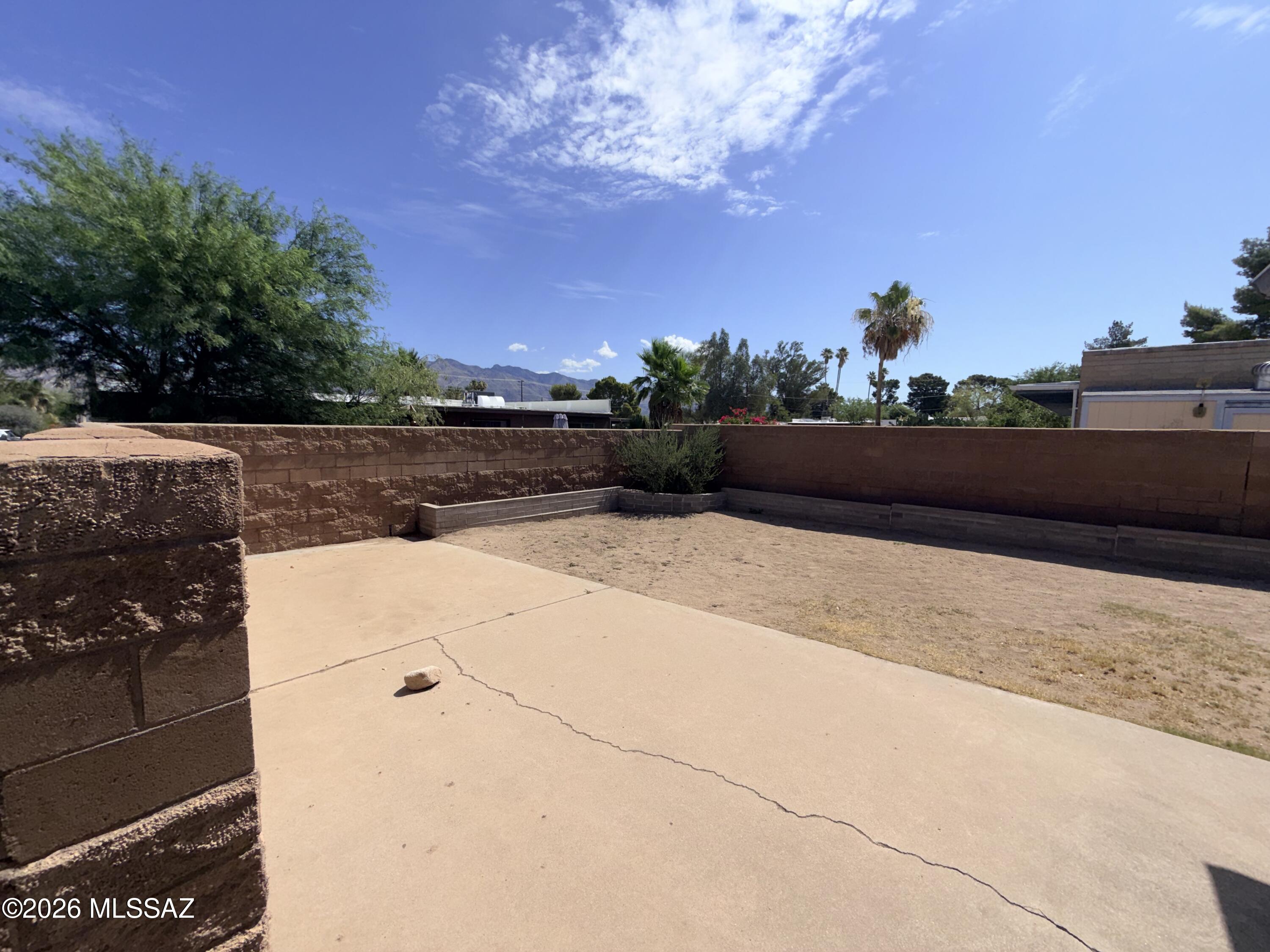Great central location adjacent to Winterhaven.  Great room off the kitchen with fireplace.  Separate living and dining rooms.  Great mountain views from a covered back patio.  Large backyard.  Tiled floors throughout. Newer windows that buffer sound extremely well.