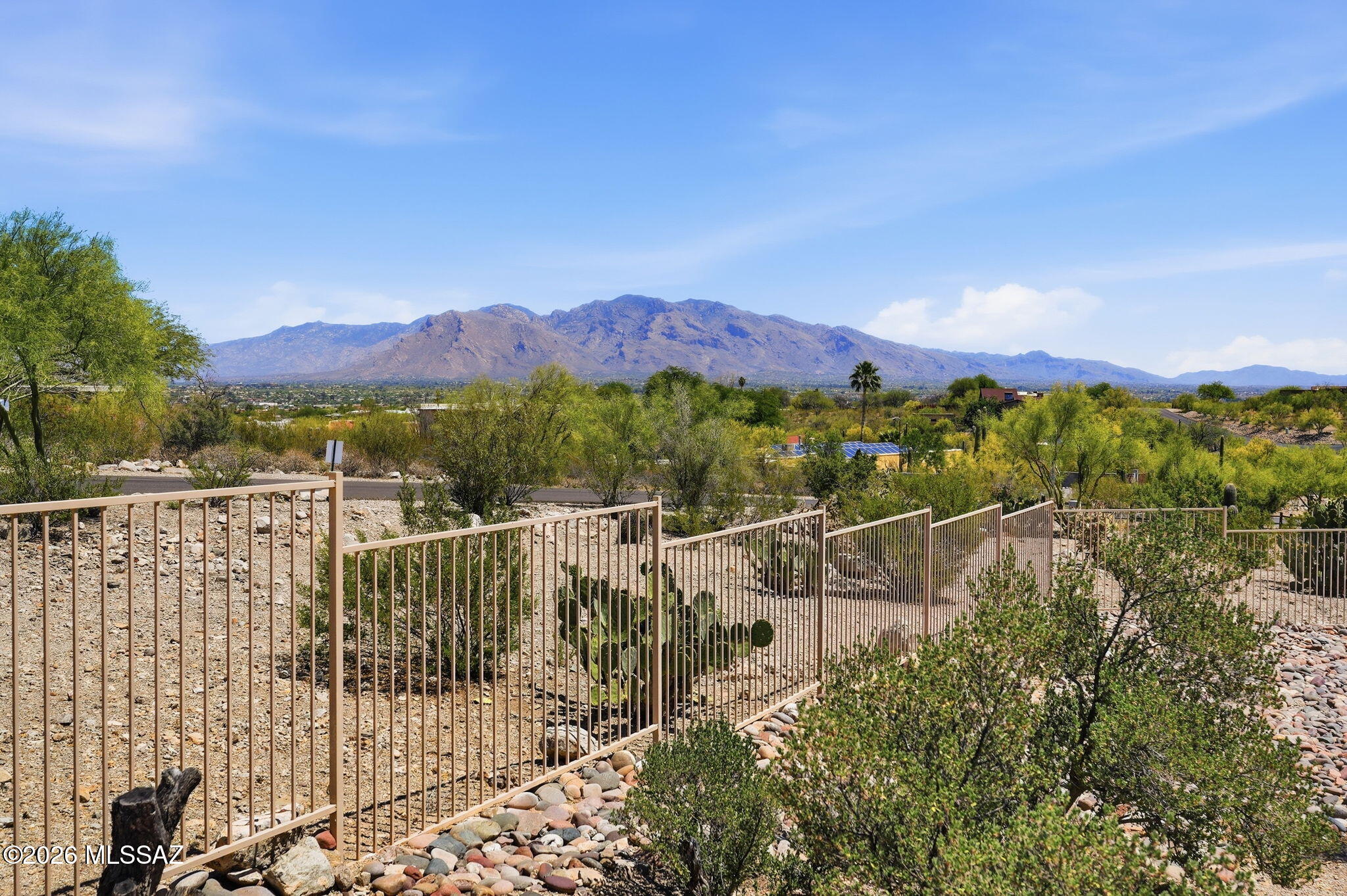 This beautiful, custom-built home sits on a one-acre horse property with NO HOA and includes an available RV space. The property offers unobstructed views of Pusch Ridge and the Catalina Mountains. Inside, the house features three bedrooms, two full baths, a living room, a family room, an eat-in kitchen, a formal dining room, and a laundry room. The garage features epoxy flooring and a split AC system. The outdoor living space is perfect for entertaining, featuring a covered patio, a heated spa, a built-in BBQ, a sink, and a bar area. Given the features and the price point, this property will not last long.