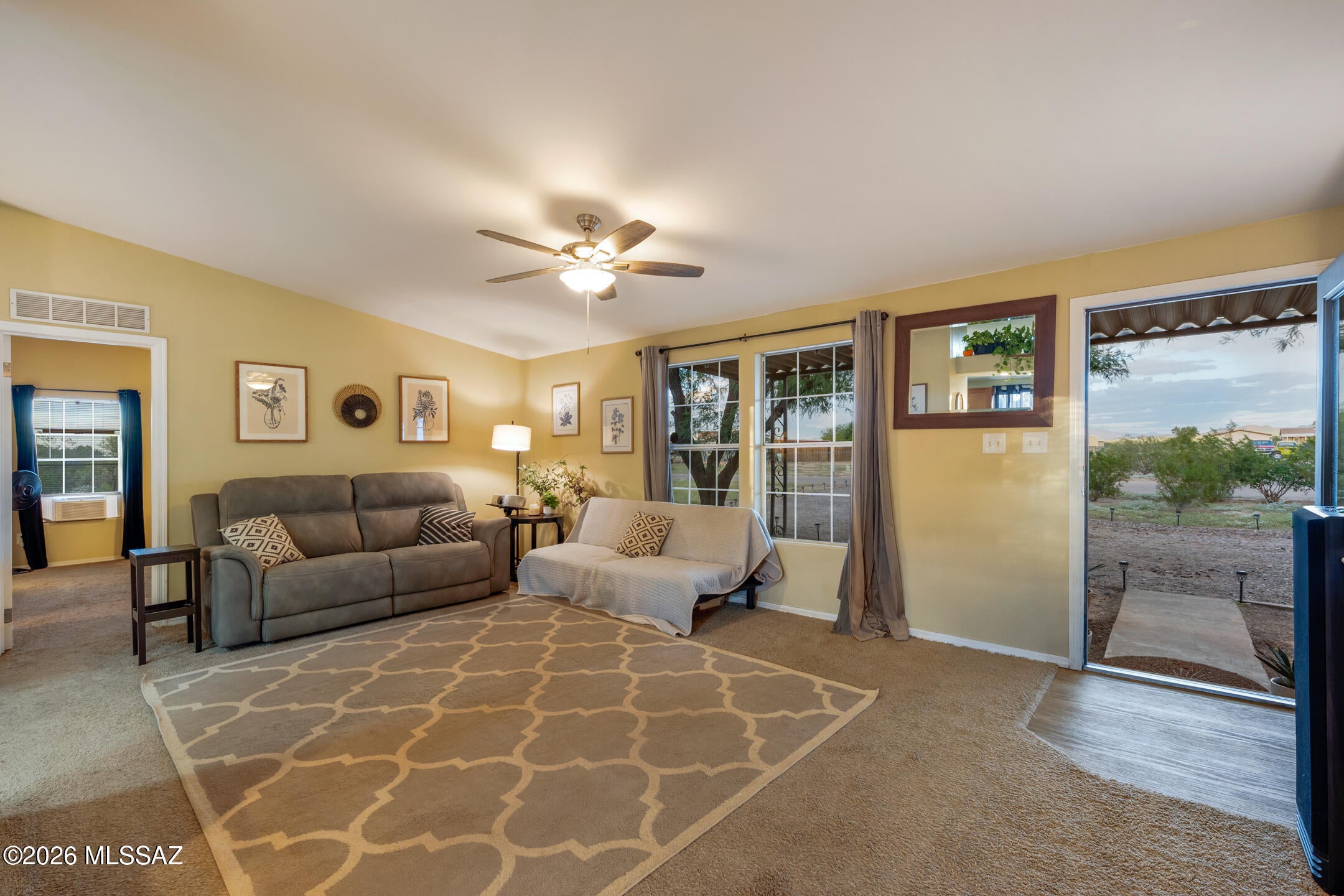Enjoy mountain views and room to spread out on this 1.07-acre corner lot in the Picture Rocks area. This 3-bedroom, 2-bath manufactured home offers approximately 1,431 square feet with a split-bedroom floor plan, a spacious great room, and a dedicated dining area. The kitchen features a gas range and stainless steel appliances, while a separate laundry room adds everyday convenience. The primary suite includes a walk-in closet and a bathroom with dual sinks, a corner soaking tub, and a separate shower. Outside, natural desert landscaping and mature trees complement the rural setting. Chain-link fencing, a circular gravel driveway, storage sheds, and space for RV parking add practical appeal. Nearby Saguaro National Park offers opportunities for hiking and exploring the Sonoran Desert. A welcoming property with comfortable living space and room to enjoy the outdoors. Your next chapter starts here!