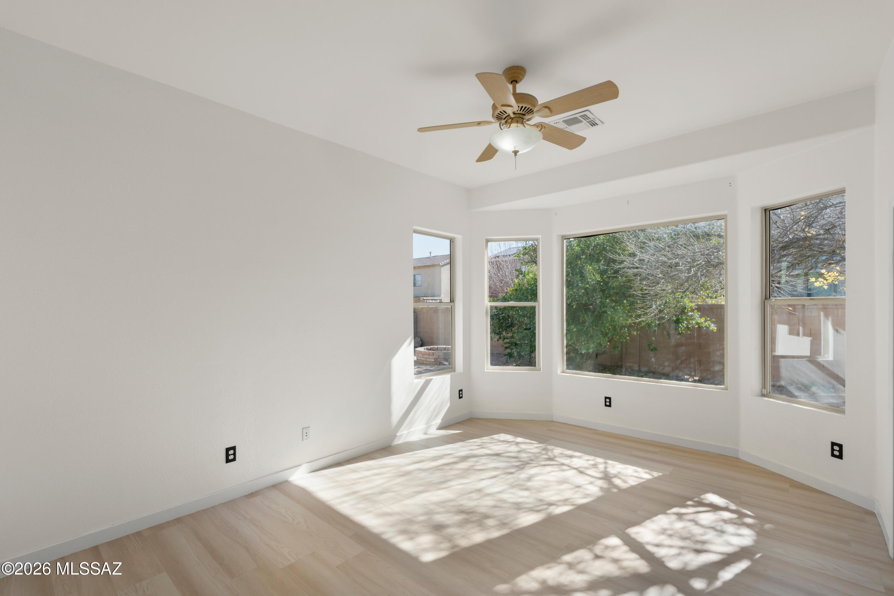 Welcome to 86 W. Camino Rancho Cielo, a charming 3-bedroom, 2-bath, single-story home in the desirable Rancho Sahuarita community. This well-designed residence features abundant natural light throughout and a functional layout ideal for everyday living. The guest bathroom has been updated, while the primary suite offers a peaceful retreat with bay windows and a dual-sink vanity. Enjoy outdoor living in the backyard with a built-in fire pit, perfect for relaxing or entertaining. Additional highlights include a 2-car garage and convenient access to Rancho Sahuarita's amenities, including pools, fitness centers, parks, lakes, trails, and community events, all close to schools, shopping, and dining.
