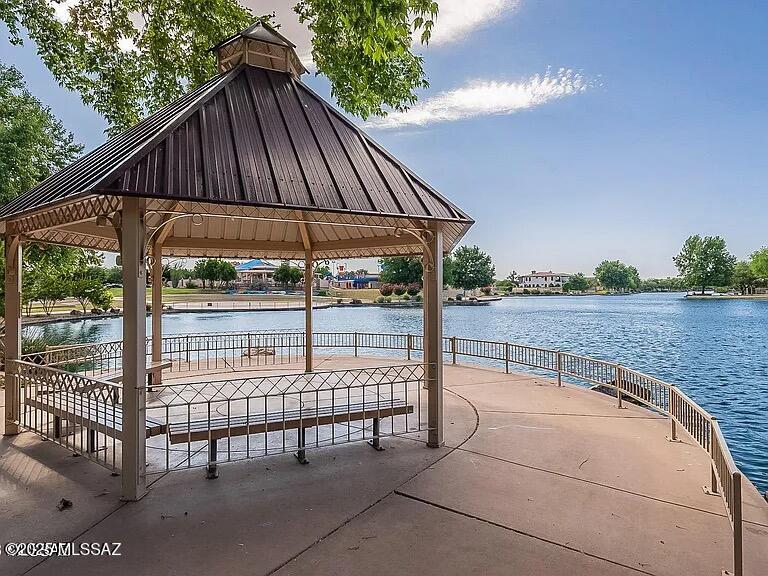 Welcome to your DREAM HOME with an unbeatable 2.375% Assumable VA Loan! This immaculate move-in ready GEM features OWNED SOLAR PANELS- providing year round energy savings, a gorgeous gourmet kitchen with excellent lighting, and a spacious great room perfect for family gatherings & entertaining. This home also boasts new luxury vinyl plank flooring upstairs and beautiful ceramic tile downstairs. Outdoors, you can step into your beautifully landscaped backyard oasis with no rear neighbors, complete with an extended covered patio, pavers, built-in barbecue, decorative gas pit, and a charming pergola! Enjoy fresh fruit from two delicious orange trees & one lemon tree, alongside eight beautiful pine trees that enhance your outdoor retreat. This property is not just a home; it's a lifestyle! Don't miss the chance to make it yours. Plus, you'll LOVE living in the award winning amenity filled community of Rancho Sahuarita, where you can enjoy a plethora of parks, walking trails, a gorgeous club house, water park, and a beautiful and serene 10 acre lake! Don't wait, schedule your showing today!