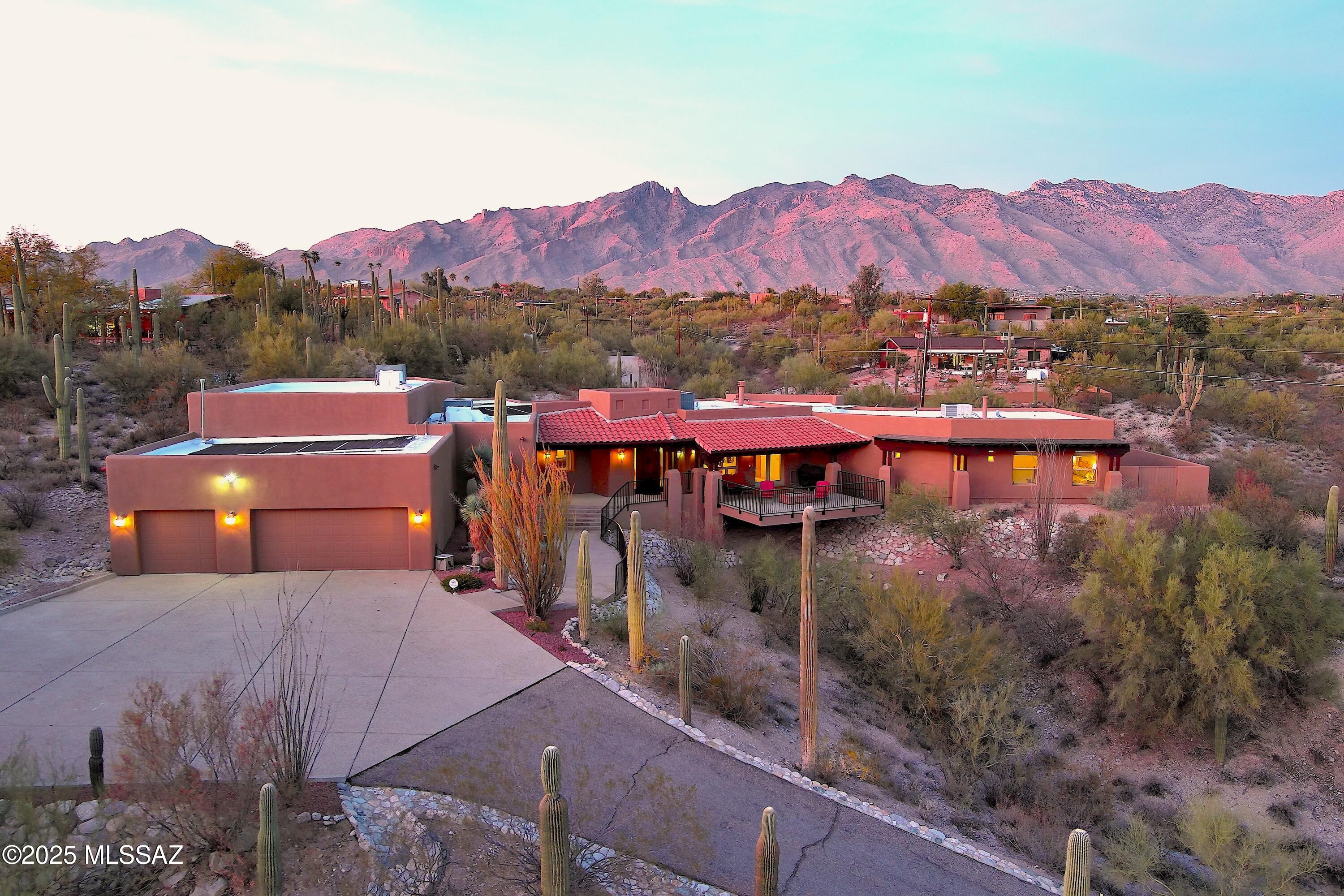 Welcome to Catalina Foothills Luxury Living as it was designed to be enjoyed. This private hilltop dream home offers regal mountain, city, & sunset views, abundant driveway space, room for RV, mega 3 car garage, oversized solar heated sparkling pool, basketball court & outdoor retreats for entertaining, reading, creating, or taking in the fresh air. The chef's kitchen with Frigidaire Pro Refrigerator/Freezer, New Microwave, New Dishwasher, prep sink & custom granite counters will delight. Bonus Den/Nursery/yoga./Lounge Room. New Exterior Paint. New Exterior Wood Stain. New Roof Coating. Newer top of the line Rinnai Tankless Water Heater. Newer HVACs. 5G. Alarm System. New premium carpeting throughout. 2 Gas Fireplcs, balcony gas firepit, gas stubs for BBQ's, lots of storage. This is HOME!