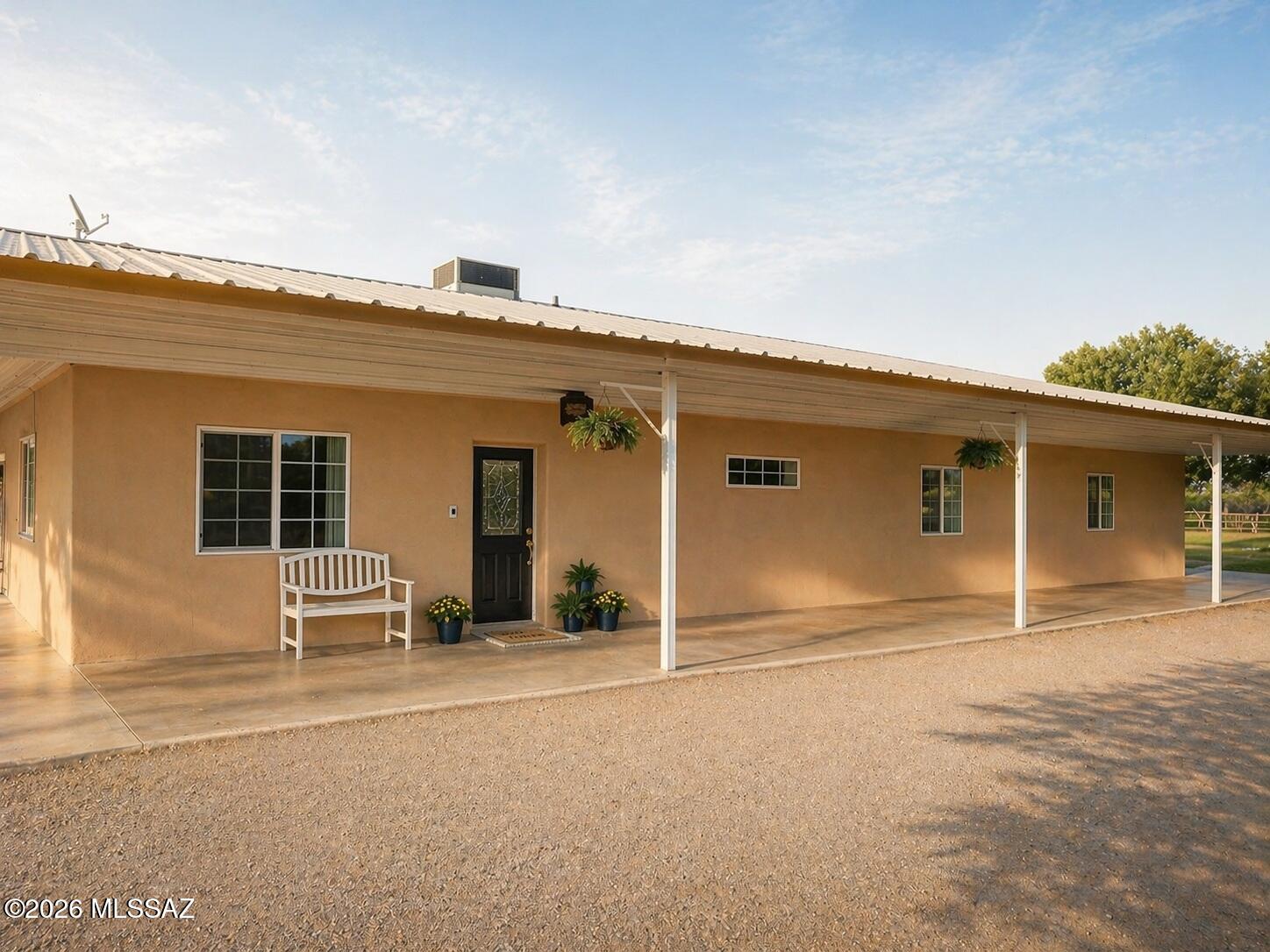 THREE ADDITIONAL ROOMS (currently used as bedrooms & office). Custom-built home on over 10 acres in the Pima area offering space, privacy, and long-term durability. Approximately 4,080 sq ft including a full basement, 2 bedrooms plus additional flexible-use rooms, and 2.75 bathrooms. Constructed with Eterna block, full steel framing, and a metal roof, with 20 solar panels for energy efficiency. Features include a 3-car garage, indoor elevator, private well plus city water, and a new 5-ton A/C system (2026). Convenient access to Highway 70 while maintaining a quiet, open setting.