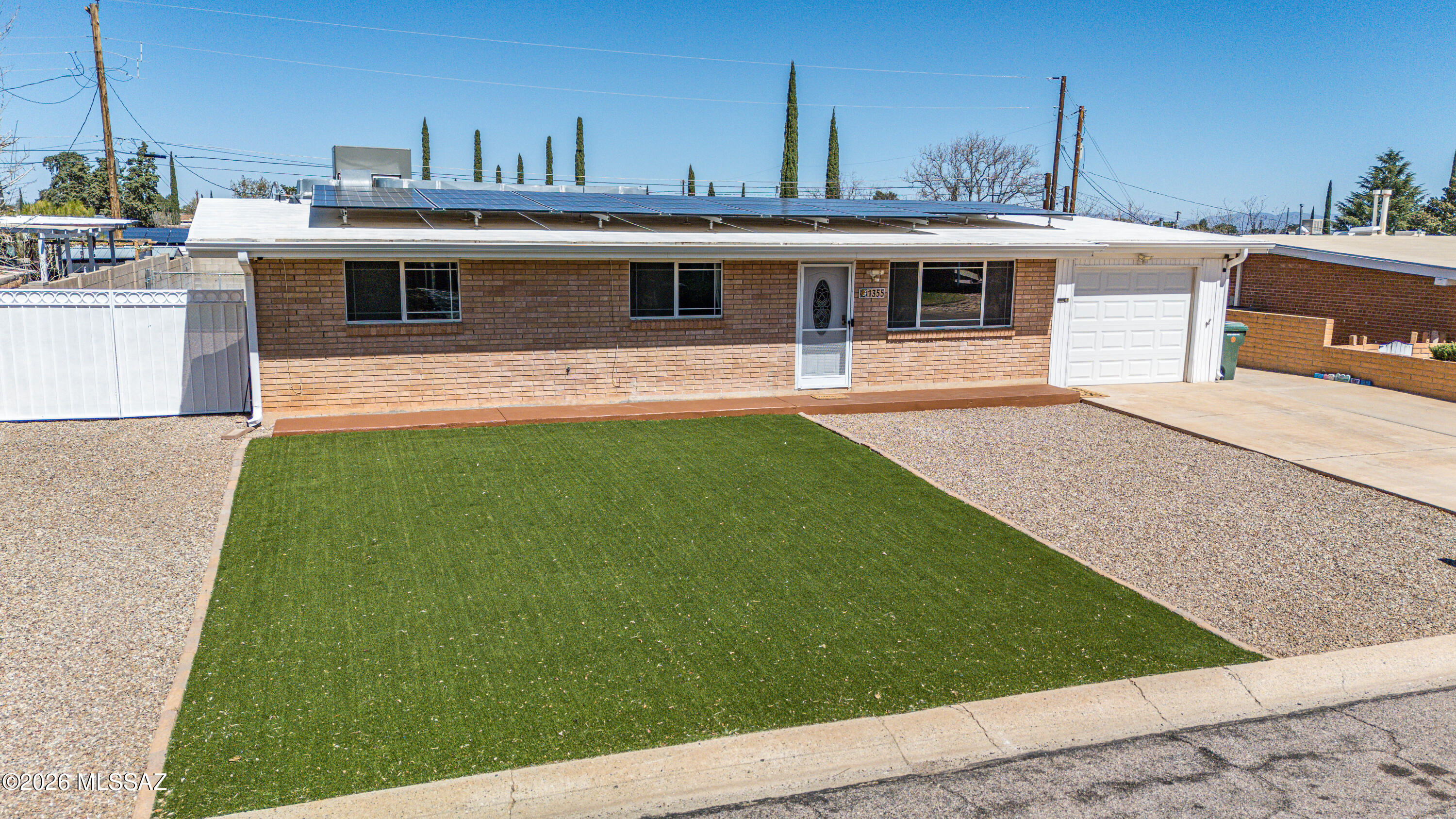 Spacious and energy-efficient, all electric home with SOLAR. This beautiful home offers 3 bedrooms and 2 bathrooms with comfortable layout. Enjoy two separate living spaces, perfect for relaxing, entertaining, or creating a home office or game room. The large eat-in kitchen features granite countertops, stainless steel appliances, and plenty of room for gathering with family and friends. Step outside to your private backyard oasis with a sparkling pool, ramada for shaded outdoor living, and low-maintenance turf in both the front and back yards, perfect for year-round enjoyment
