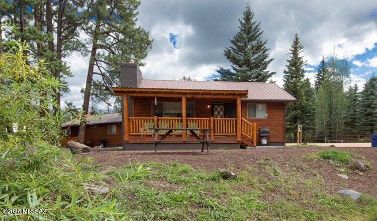 INVESTMENT OPPORTUNITY - GREER LODGE RESORT - 2 BEDROOM & 1 BATH 750 SF CABIN WITH 250 SF DECK ON THE LITTLE COLORADO RIVER. RESORT PROPERTY BORDERS NATIONAL FOREST. LARGE FRONT DECK FACES NORTH WITH THE RIVER JUST STEPS AWAY. METAL ROOF AND WOOD LAP SIDING. BEDROOM 1 HAS A KING BED, BEDROOM 2 HAS A QUEEN BED, & FOLD OUT COUCH (SLEEPS 6) CABIN IS COMPLETELY FURNISHED WITH APPLIANCES, BIG SCREEN TV, KITCHEN UTENSILS, ETC. EVERYTHING YOU NEED FOR YOUR NIGHTLY RENTAL INVESTMENT OR PRIVATE RETREAT. IN 2025 CABIN 88 PROVIDED AN ANNUAL REVENUE OF $47,315 THROUGH NIGHTLY RENTALS. YOU CAN OWN A CABIN IN GREER ON THE RIVER AND RENT IT OUT. SPECIAL FINANCING AVAILABLE.