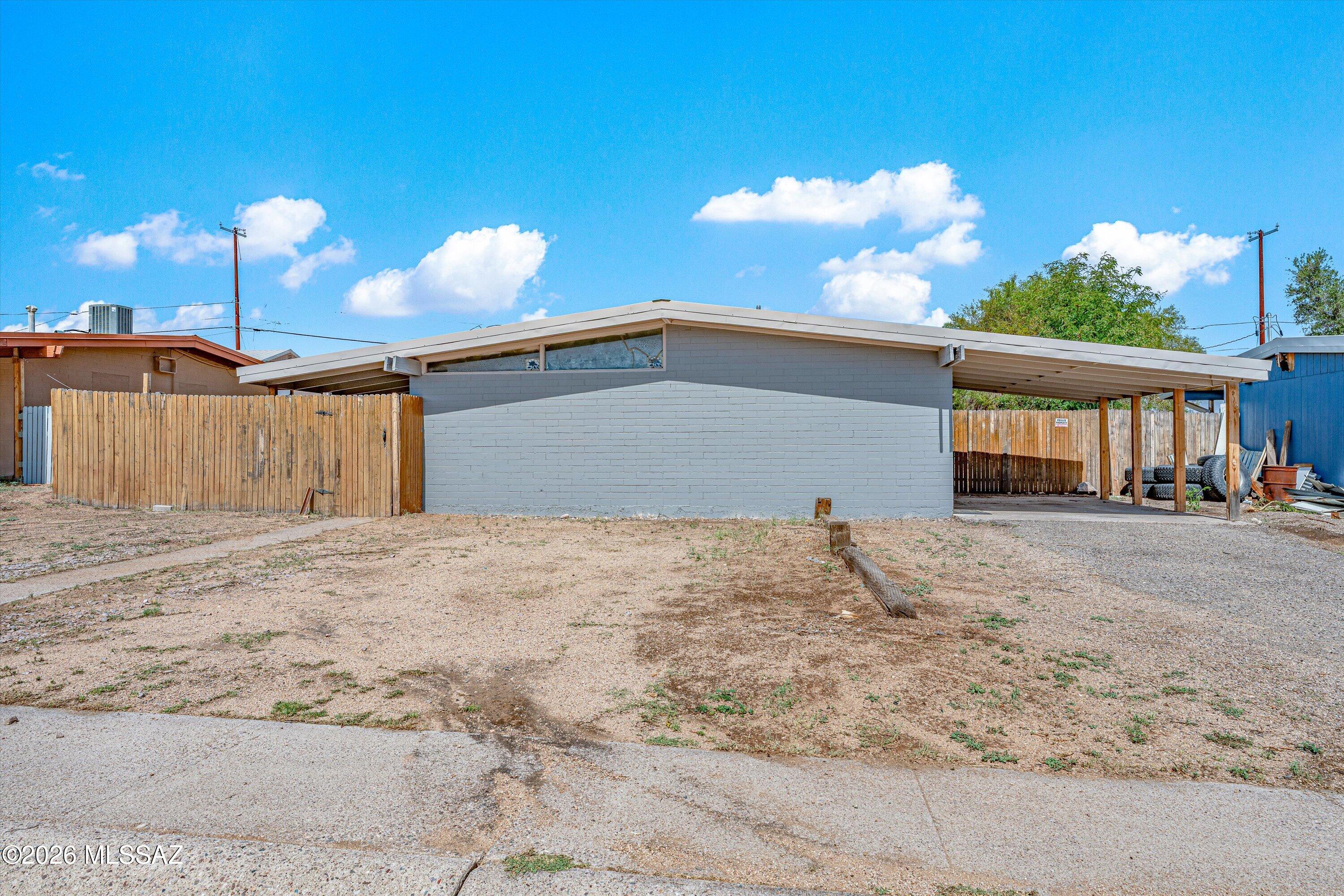 **Seller will give $5,000 credit towards new appliances!** This 2-bed, 1-bath home with a metal roof and central AC backs to the desert for privacy and sunset views! This property has been completely remodeled inside and out, with new flooring, interior/exterior paint, kitchen cabinets, and remodeled bathroom with tile shower and vanity. Newly installed water heater, and top-of-the-line air conditioning unit. The large backyard is fully-fenced, with a gate for alley access and no neighbors behind!