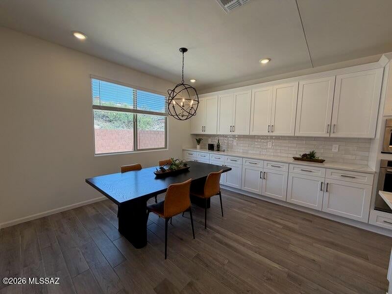 Discover the space and flexibility you've been looking for in this brand-new, energy-efficient home! Featuring 5 bedrooms plus a versatile flex room, there's plenty of space for a home office, game room, or teen retreat. Guests will love the private first-floor bedroom and full bath tucked away near the foyer. Located in sought-after Summit at Rocking K, this Vail community offers access to award-winning Vail schools and exceptional amenities, including pickleball courts, playgrounds, and a splash pad. Move-in ready with a washer, dryer, refrigerator, and whole-home blinds. Designed with innovative energy-efficient features that deliver comfort, savings, and peace of mind for years to come.