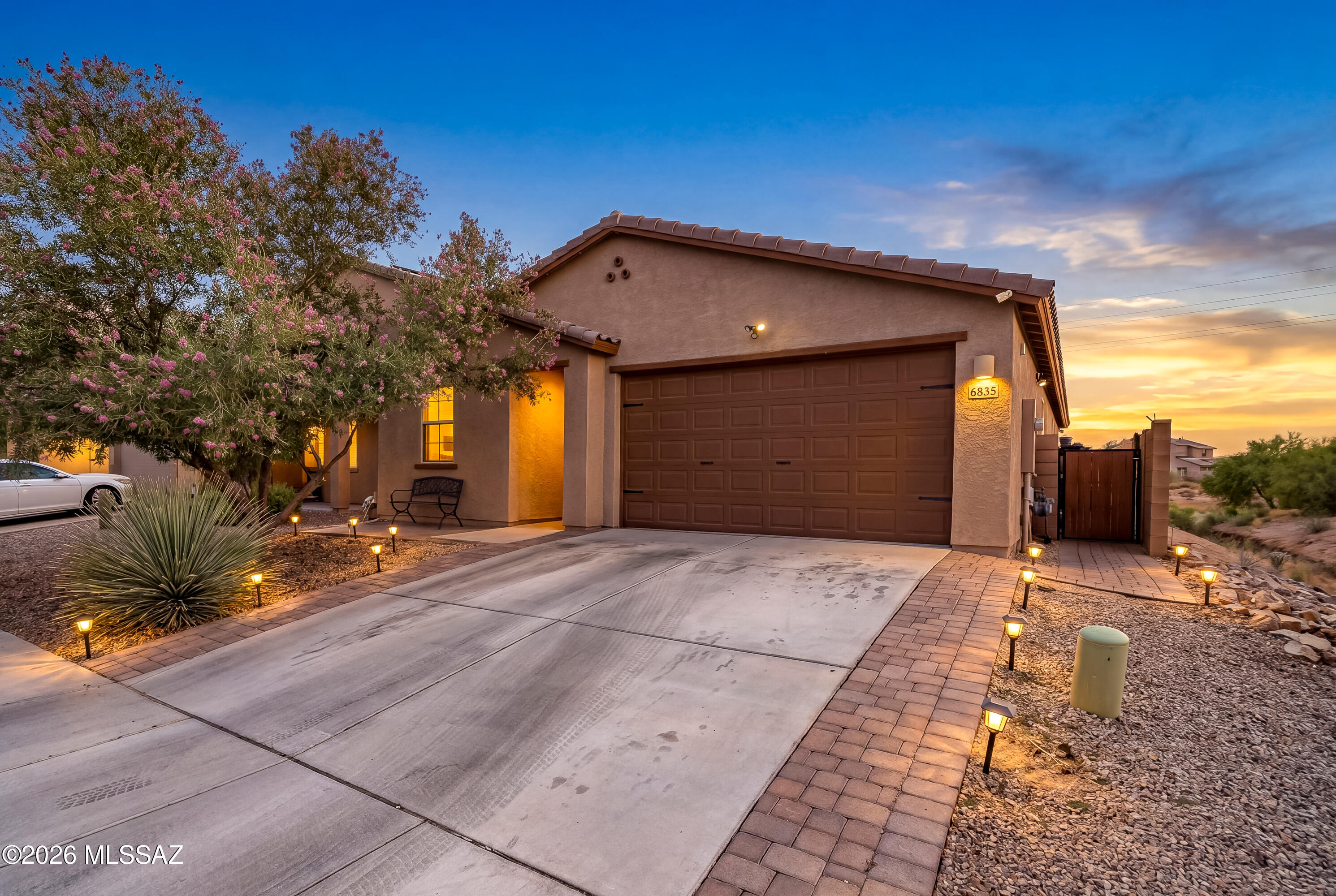 4 Bed, 2 bath beauty on the SW side of town. Approx 1836 sq ft. Beautiful, bright, open kitchen with marble accents, recessed lighting and granite countertops.  Excellent, value adding, low maintenance upgrades out back, Buy and enjoy without the need to do anything to it. Well-maintained landscaping featuring block pavers, turf, sunshade sails, and TV for entertaining under the porch. 

Master suite features tile floors, plenty of natural light, recessed lighting and ceiling fan. Large, tiled, walk-in shower with glass panels, dual vanity and walk in closet with plenty of space.

Guest bedrooms are ample, feature tile floors, faux wood blinds, recessed lighting, ceiling fans and good closet space.

2 car garage with epoxy floors and smart garage door opener. Water treatment system. Low maintenance desert landscaping out front with beautiful shade tree. No properties adjacent to the south and west sides of the home. Beautiful evening views of colors offered by the amazing Arizona sunsets.