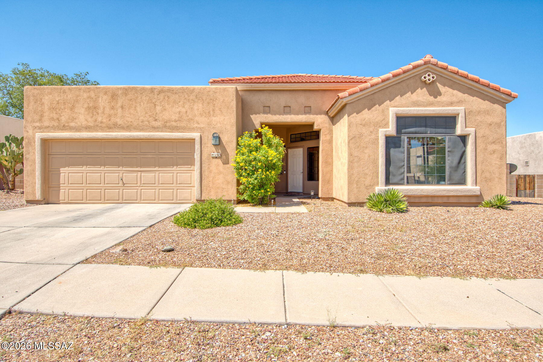 Spacious and well cared for, this 4-bedroom, 2-bath home in Silverado Hills offers plenty of room to spread out with 2,284 sq ft and a flexible floor plan. Inside you'll find high ceilings, two separate living areas and a bright kitchen with stainless steel appliances, plenty of storage and two pantries. French doors lead to the Arizona room, complete with its own mini split, giving you even more usable space for a home office, workout room, game room or additional living area. The primary suite has its own sitting area, walk-in closet and a large bath with double vanities, soaking tub and separate shower. The guest bath also features a tub/shower combination, and skylights throughout the home bring in additional natural light. Outside, the low-maintenance rock landscaping keeps yard work simple, while the covered patio and gazebo offer a great spot to relax or entertain. Conveniently located on Tucson's east side with shopping, dining, hiking and Saguaro National Park all nearby. Newer HVAC.