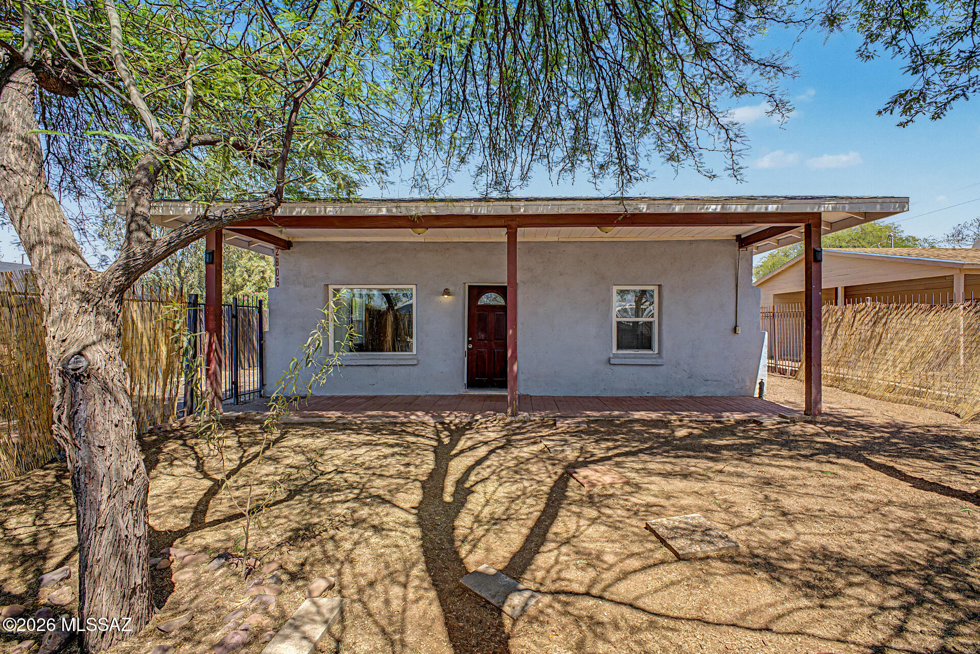 Discover your perfect mid-town Tucson retreat at 2806 N Palo Verde Ave! This inviting 2-bedroom, 1-bath 912 sq ft home welcomes you with an enclosed front yard for privacy and charm. Inside, enjoy a bright, spacious eat-in kitchen with warm wood cabinets and tile floors, comfortable living spaces with tile and plush carpet, and a full bath featuring a relaxing tub/shower combo. Step outside to your private oasis -- a large fenced front yard with a generous covered patio, mature shade trees, paver seating areas, and desert landscaping ideal for BBQs, play, or unwinding. Plenty of space in both front and back yards plus storage and laundry hookups. Superb location just minutes from the University of Arizona, parks, schools, and shopping. Move-in ready and full of potential.