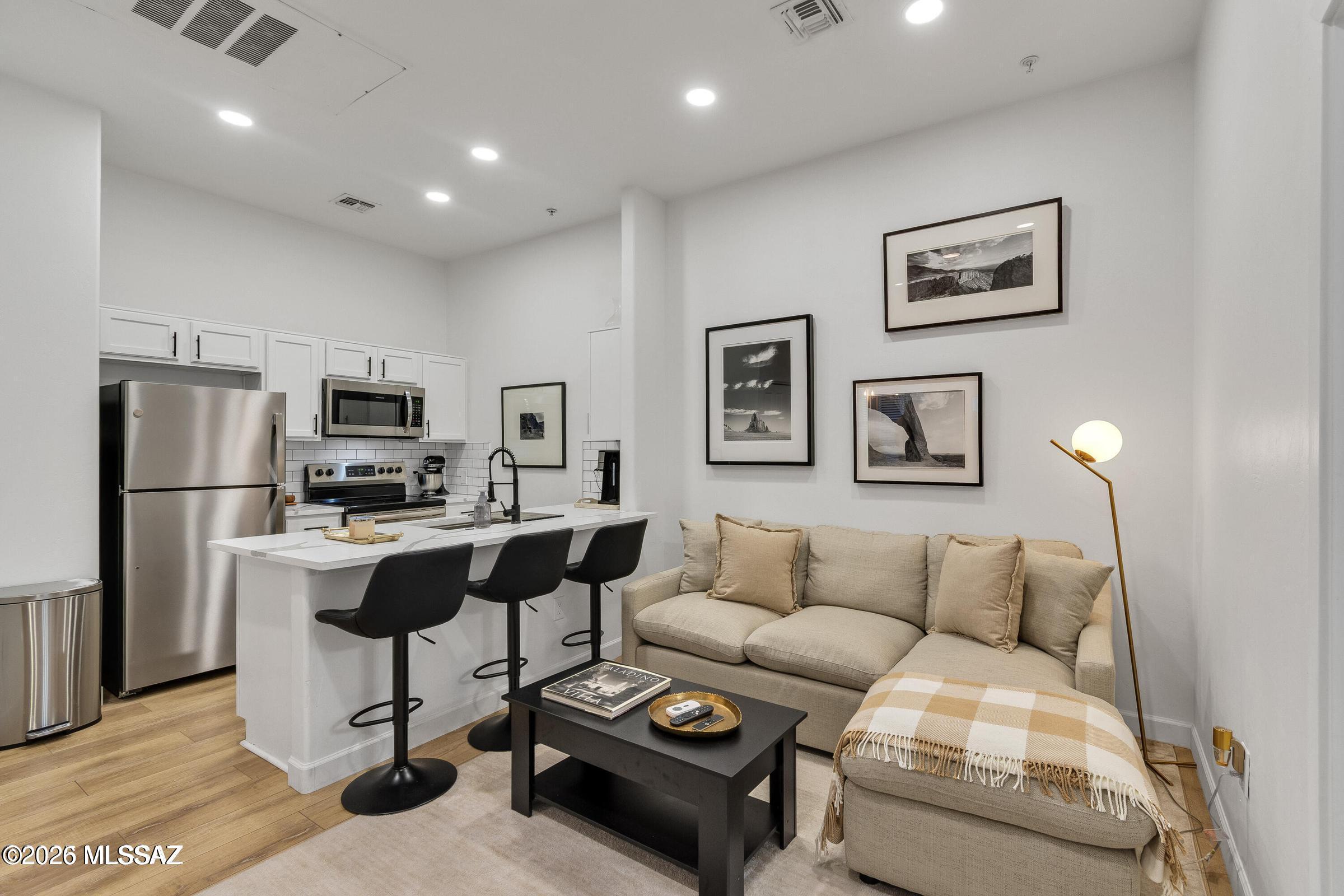 Beautiful fully furnished 2BD/2BA upstairs condo in sought-after Placita Escondida! Remodeled in 2023 with granite counters, stainless appliances, and wood-look laminate flooring-no carpet! This light-filled unit includes a covered parking spot and is just steps from Trader Joe's, Saint Philip's Plaza, and the Rillito River Walk. Enjoy resort-style amenities: pool, spa, bike path, and private gated access to The Loop. Walk to dining, shopping, and cafes. Available as a short-term 1-mo minimum Lease or as a long term lease. Equipped with everything you need - house wares, linens, washer & dryer, and Wi-Fi. All utilities included. List price is average, Season High rent $2395 and Season Low rent $1695, please call for exact pricing and availability. Call to schedule a showing today!